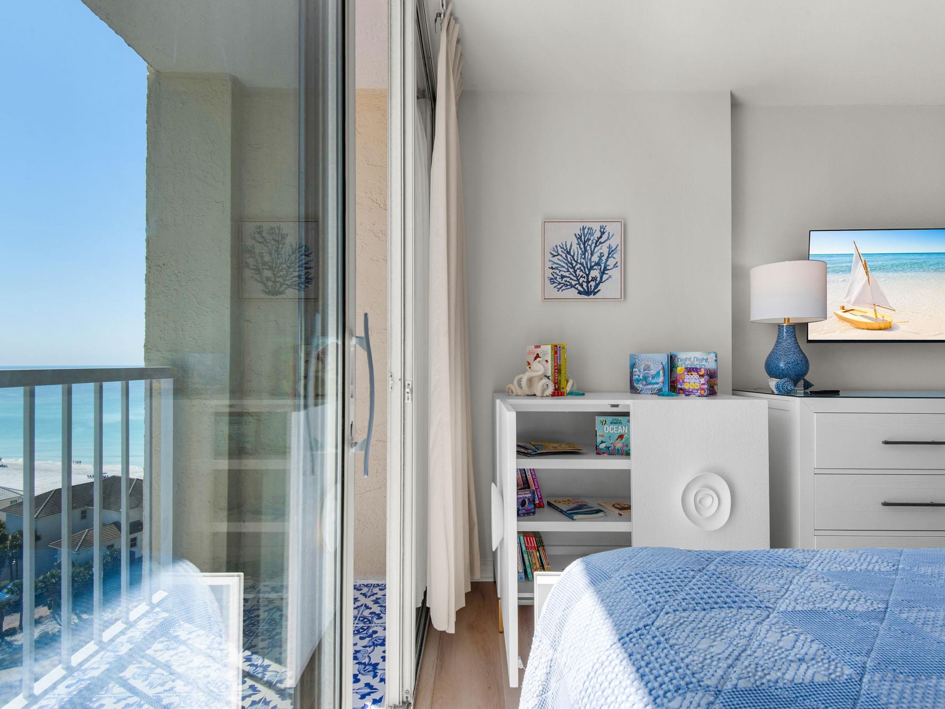 Bedroom3View of Italian Tile Deck, Gulf and Childrens Fully Stocked Book Case