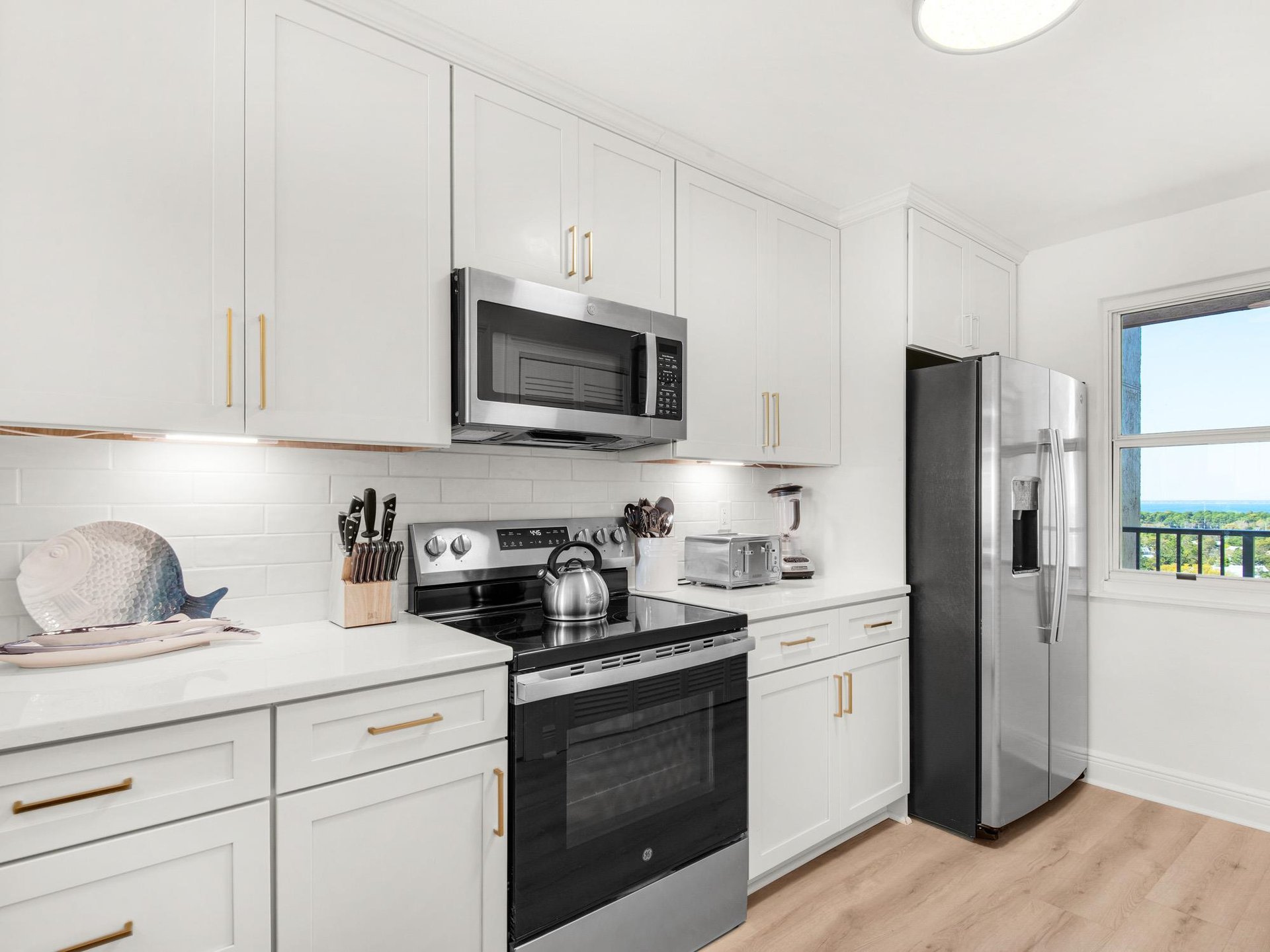 View of the Kitchen and the Window Looking out to the Bay