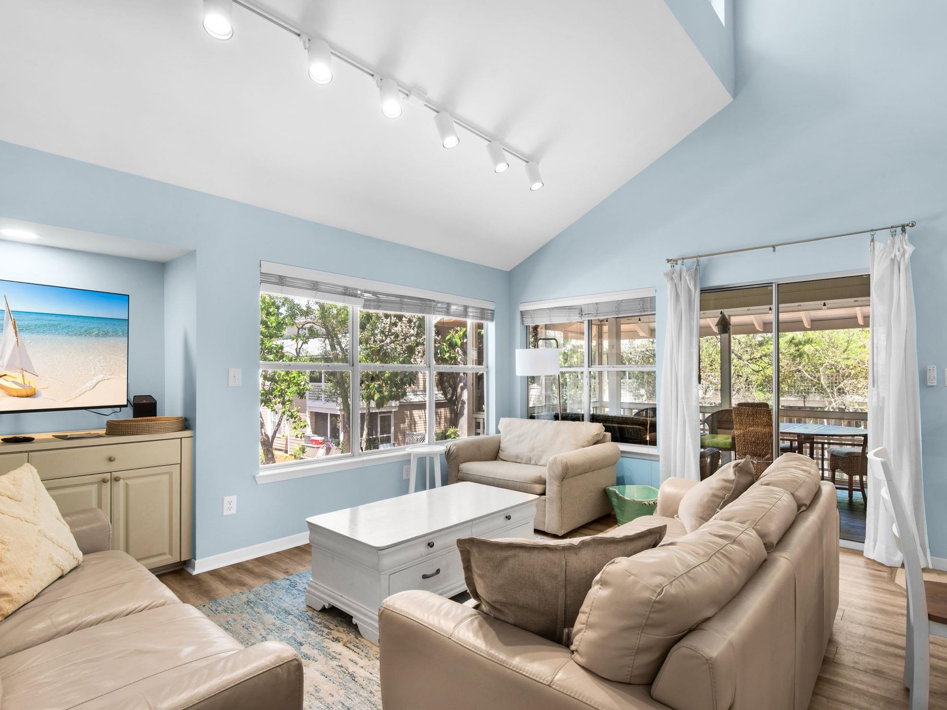 Sink into plush leather seating while enjoying natural light streaming through oversized windows, creating your perfect retreat.