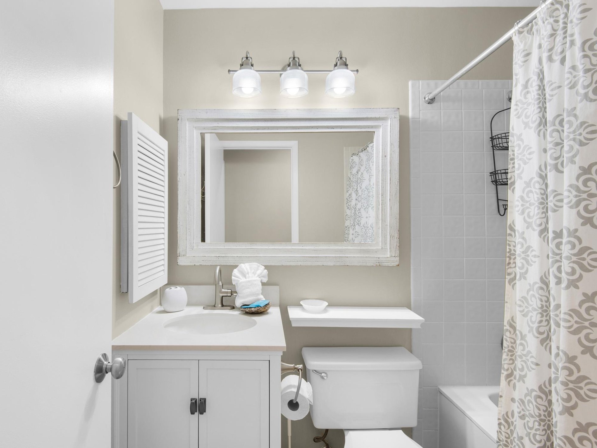 Step into your pristine bathroom with elegant white finishes, perfect lighting, and thoughtful touches that make your daily routine feel luxurious.