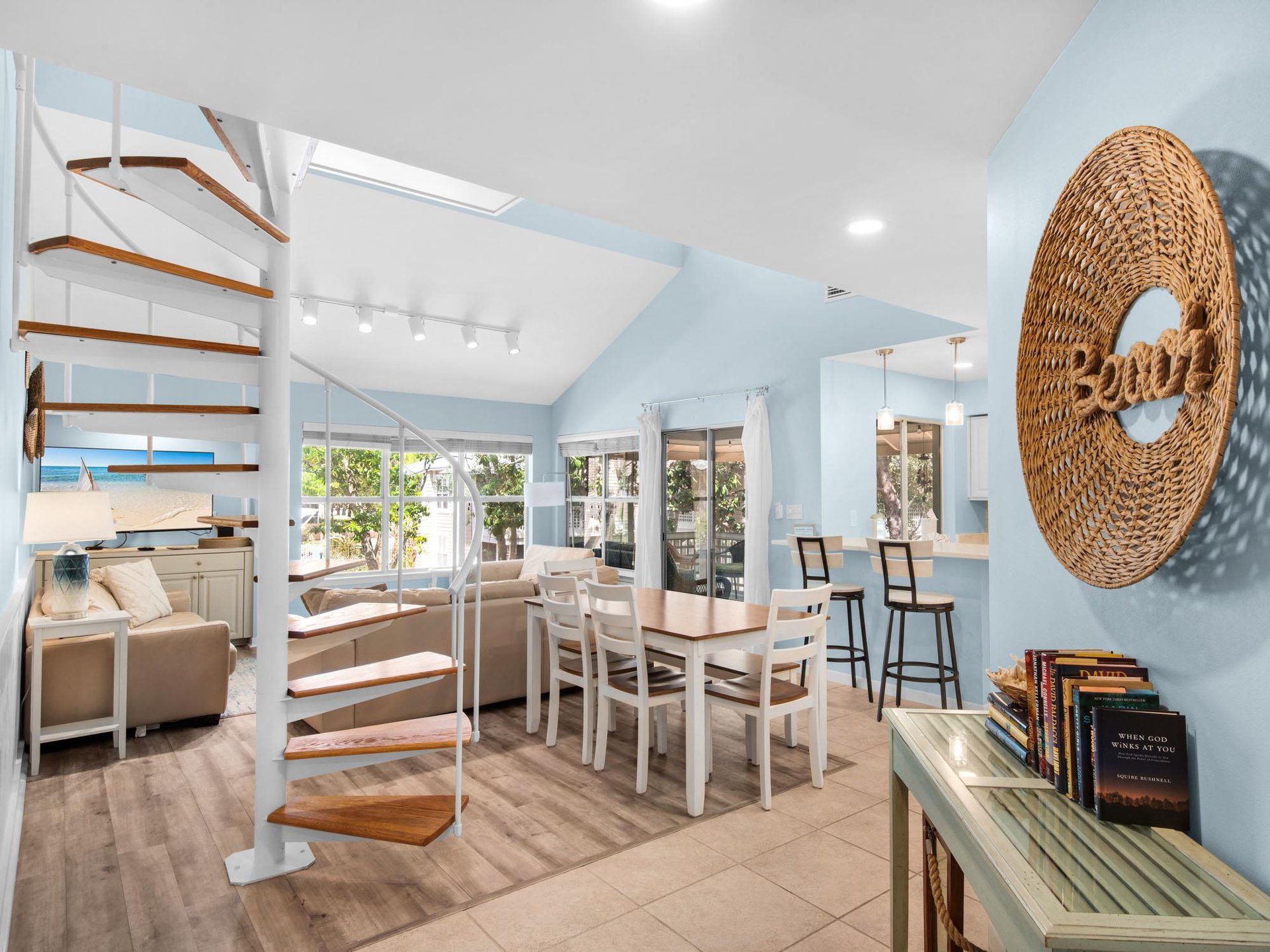 Relax in this bright, airy space where coastal blues meet warm wood tones.