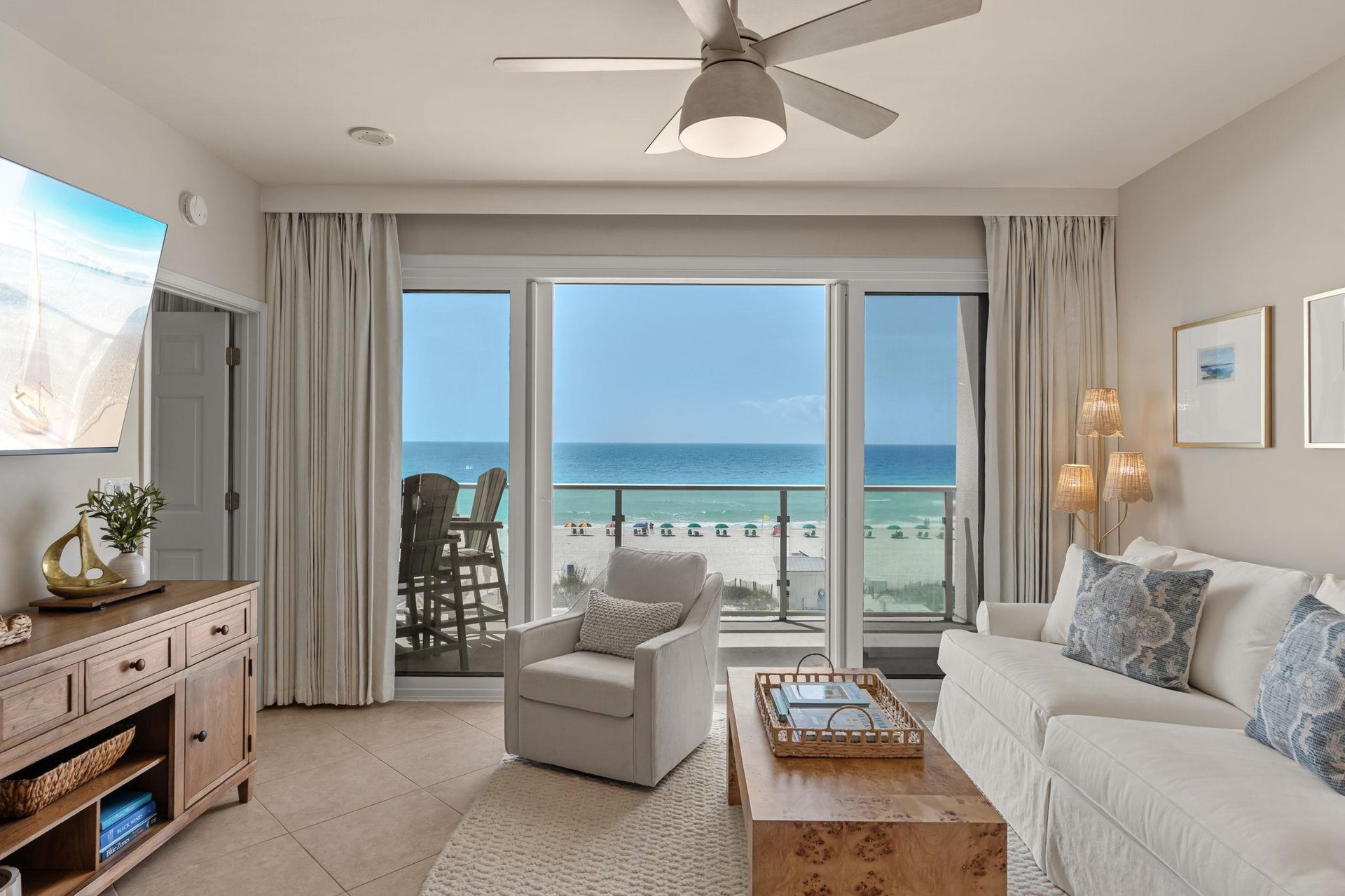 Sink into plush seating as ocean breezes flow through your private balcony doors, where stunning sea views create the perfect backdrop for relaxation.