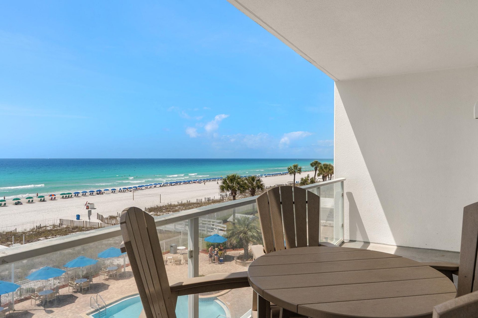 Sip your morning coffee while watching waves roll onto pristine white sand from your private balcony sanctuary.