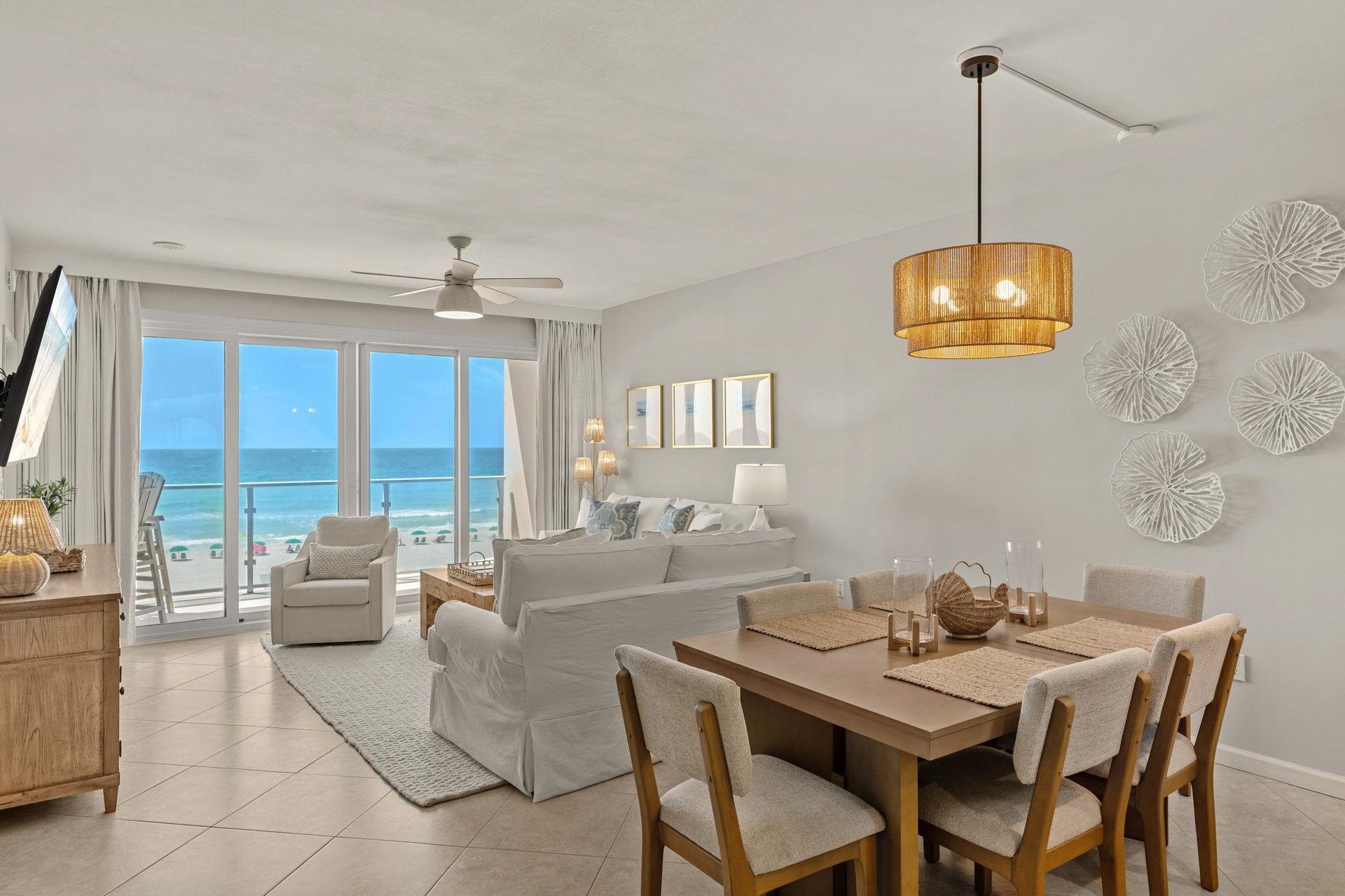 Wake up to stunning Gulf views from the bright, airy living space where coastal breezes flow through floortoceiling windows.