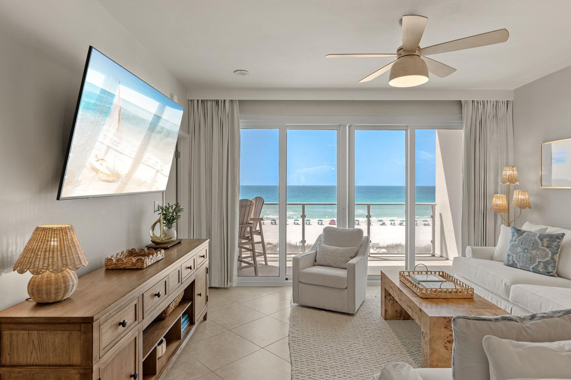 Relax in your bright beachfront living room with stunning beach views.
