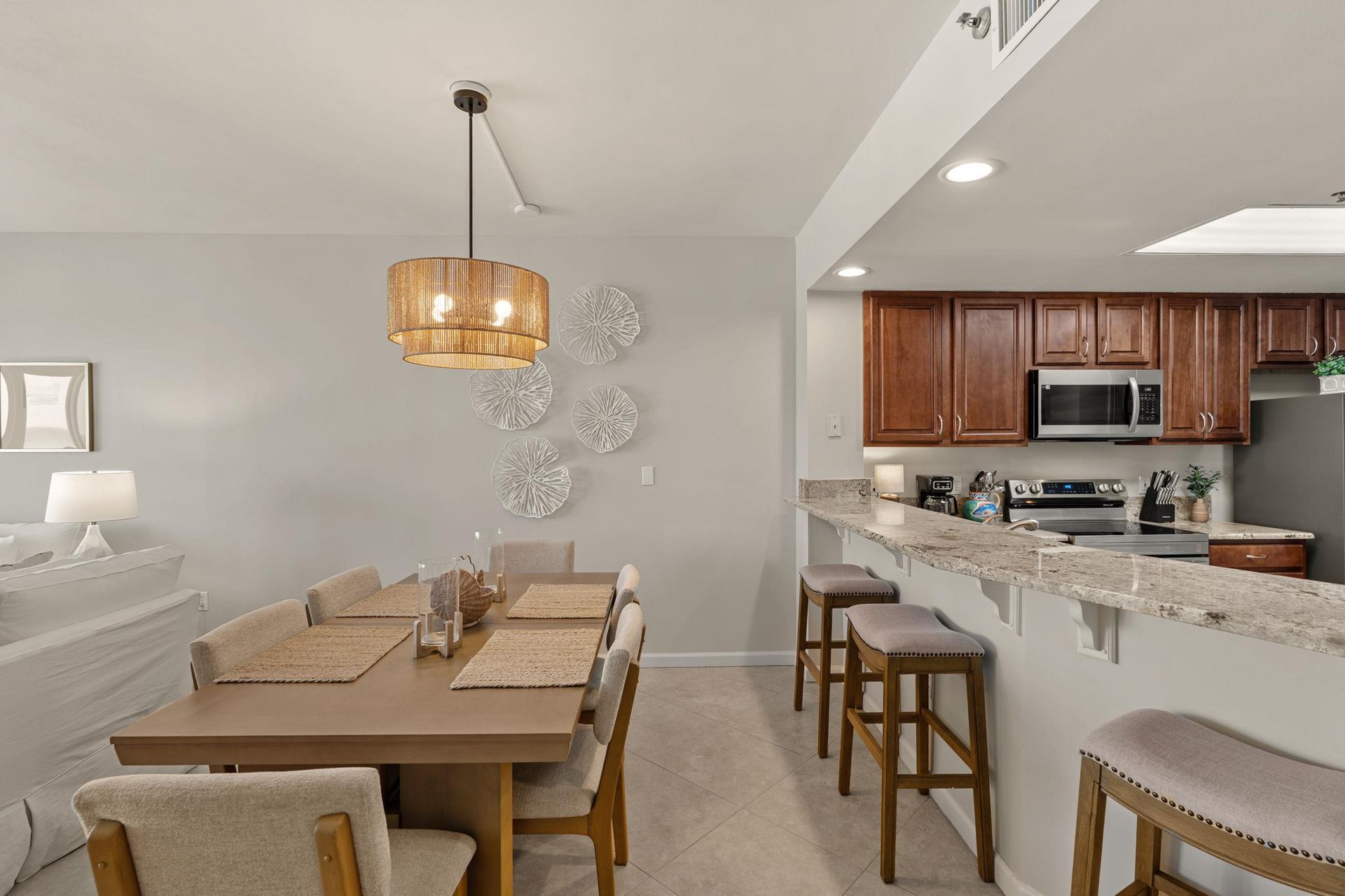 Youll love cooking and dining in this openconcept space with granite counters, modern appliances, and stylish seating for memorable meals together.