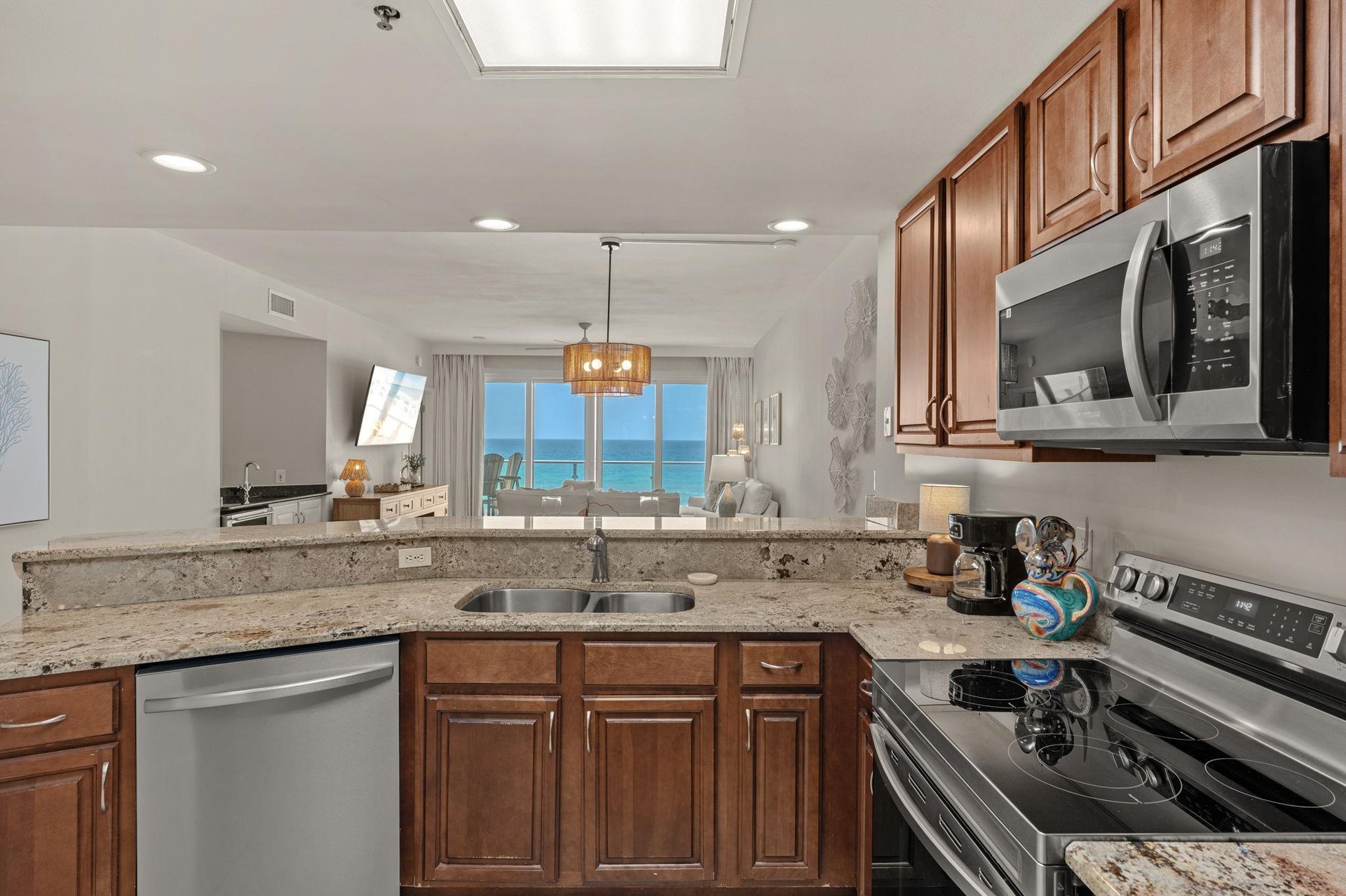 Your fully equipped kitchen with a stunning Gulf view that transforms cooking into pure joy.