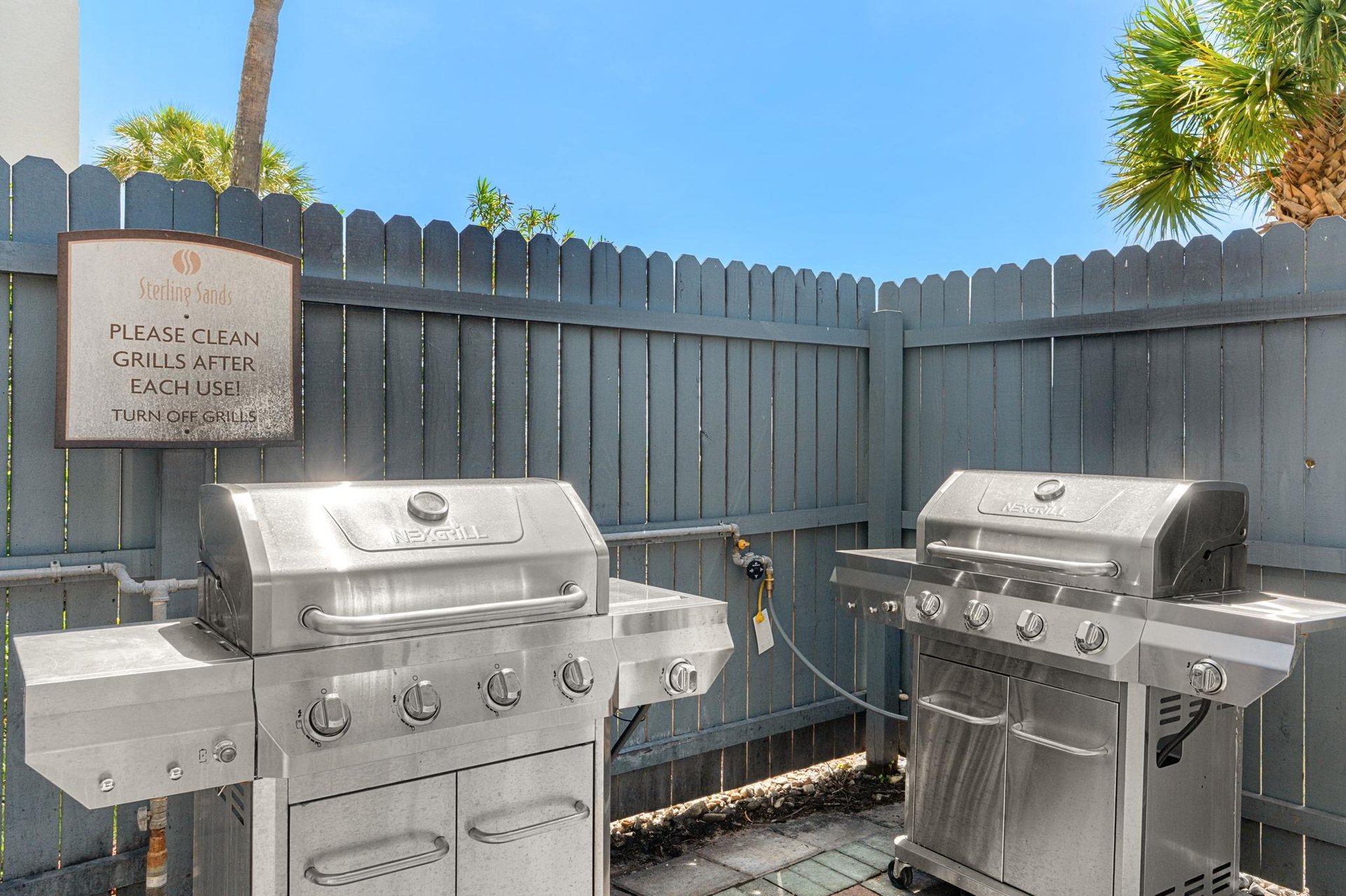 Fire up the grills in this shared outdoor BBQ area with stainless steel equipment ready for your cookout adventures.
