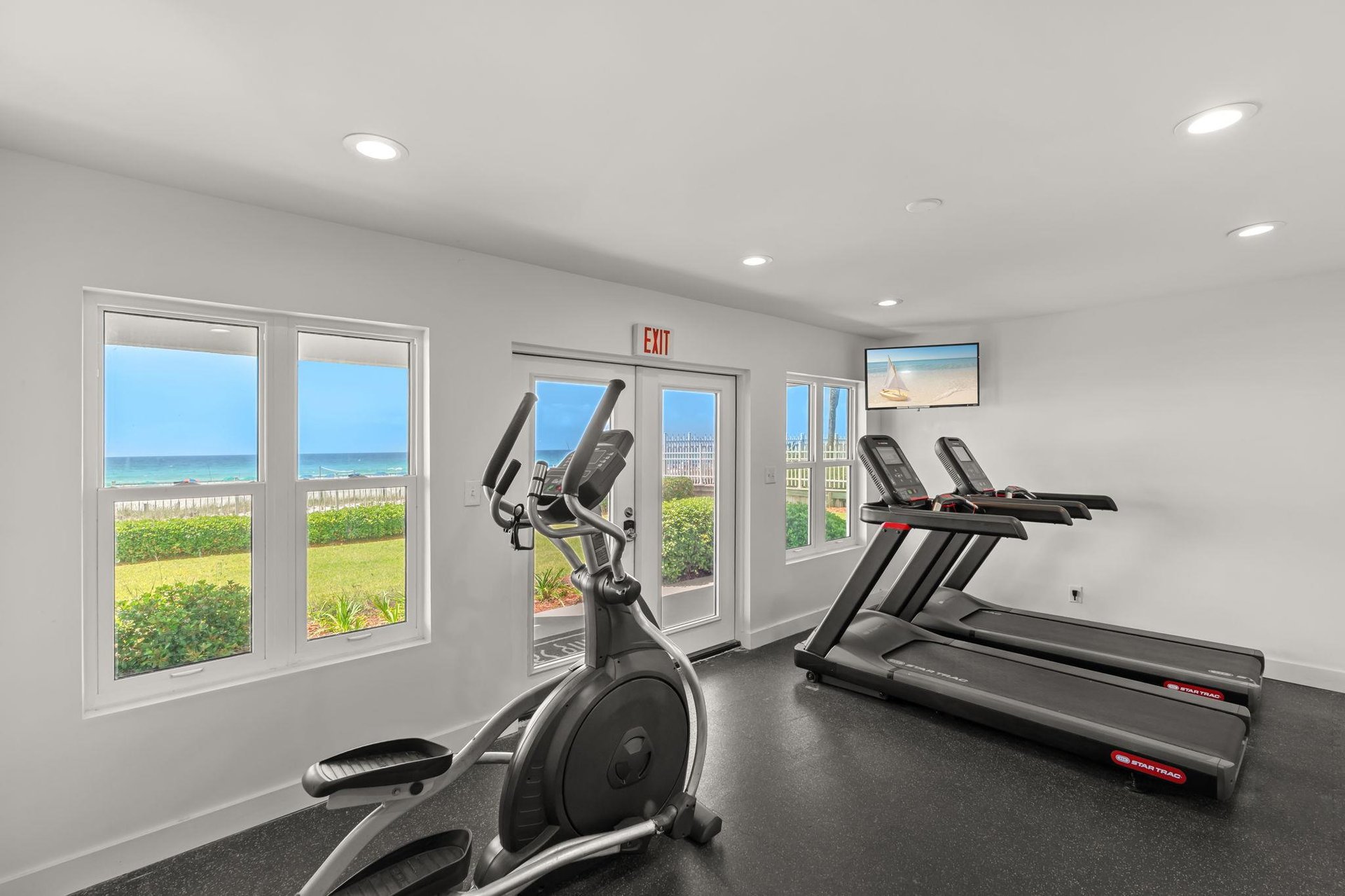 Your workout comes with stunning ocean views through floortoceiling windows in this bright fitness center.