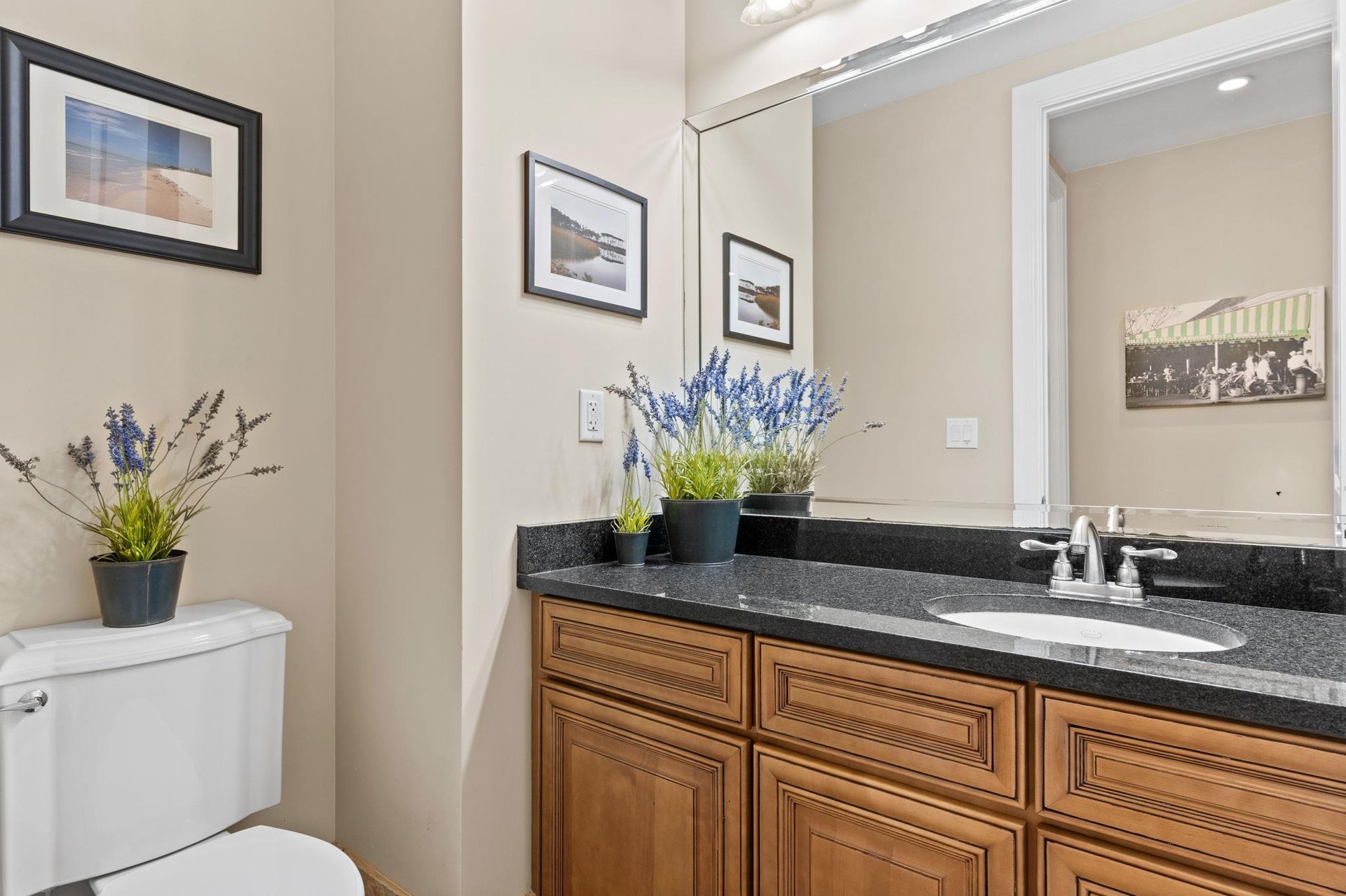 Half bathroom located just off the kitchen area.