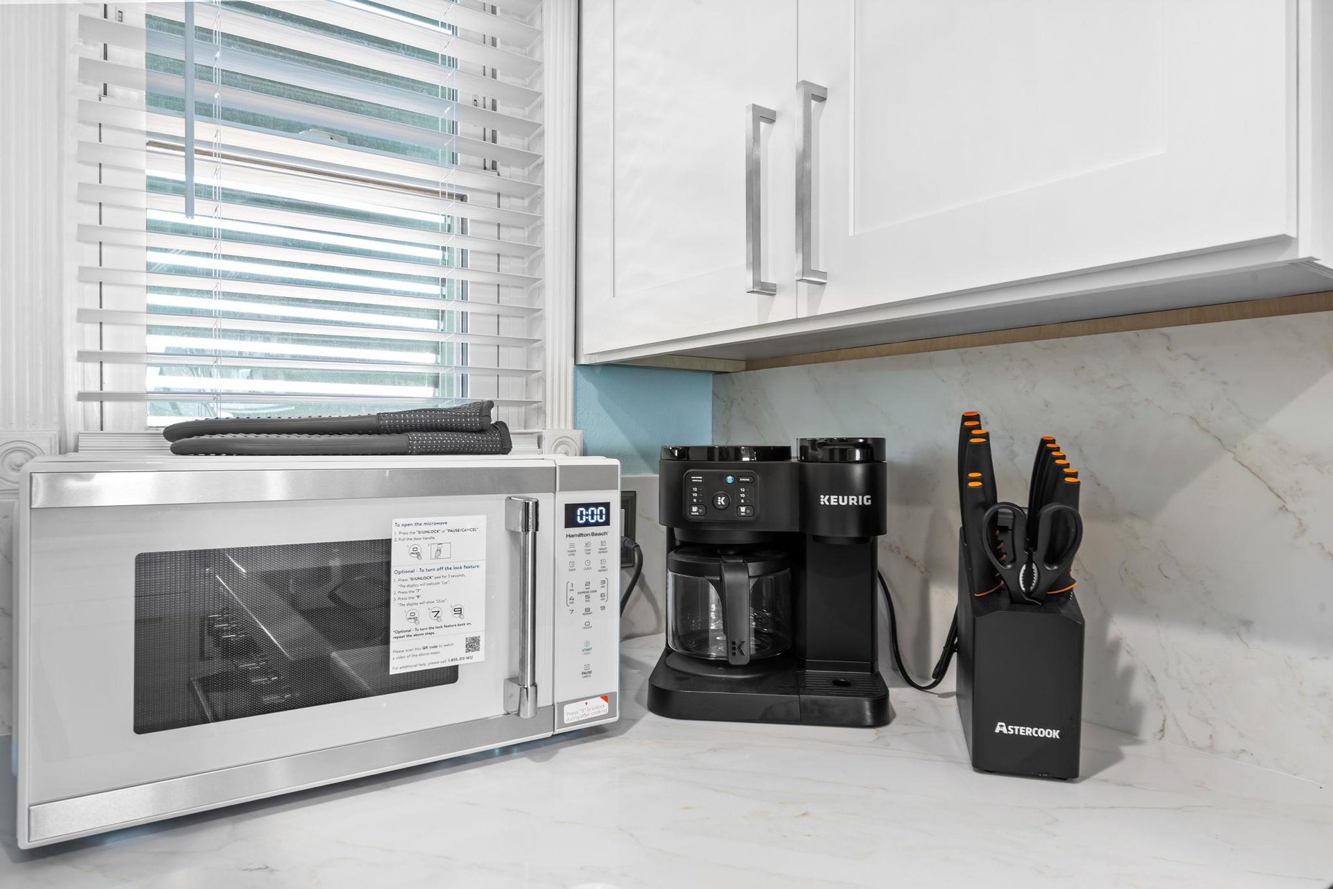 The  kitchen comes equipped with everything you need  microwave, premium coffee maker, and quality knives.