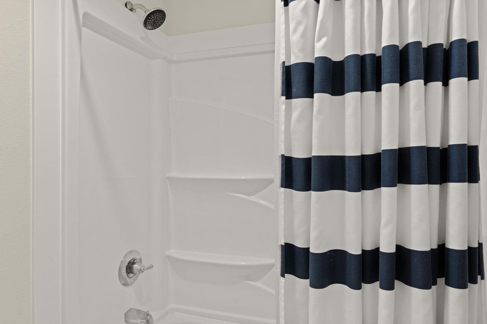 2nd floor shared bathroom open vanity area, shower and toilet area has a door for privacy