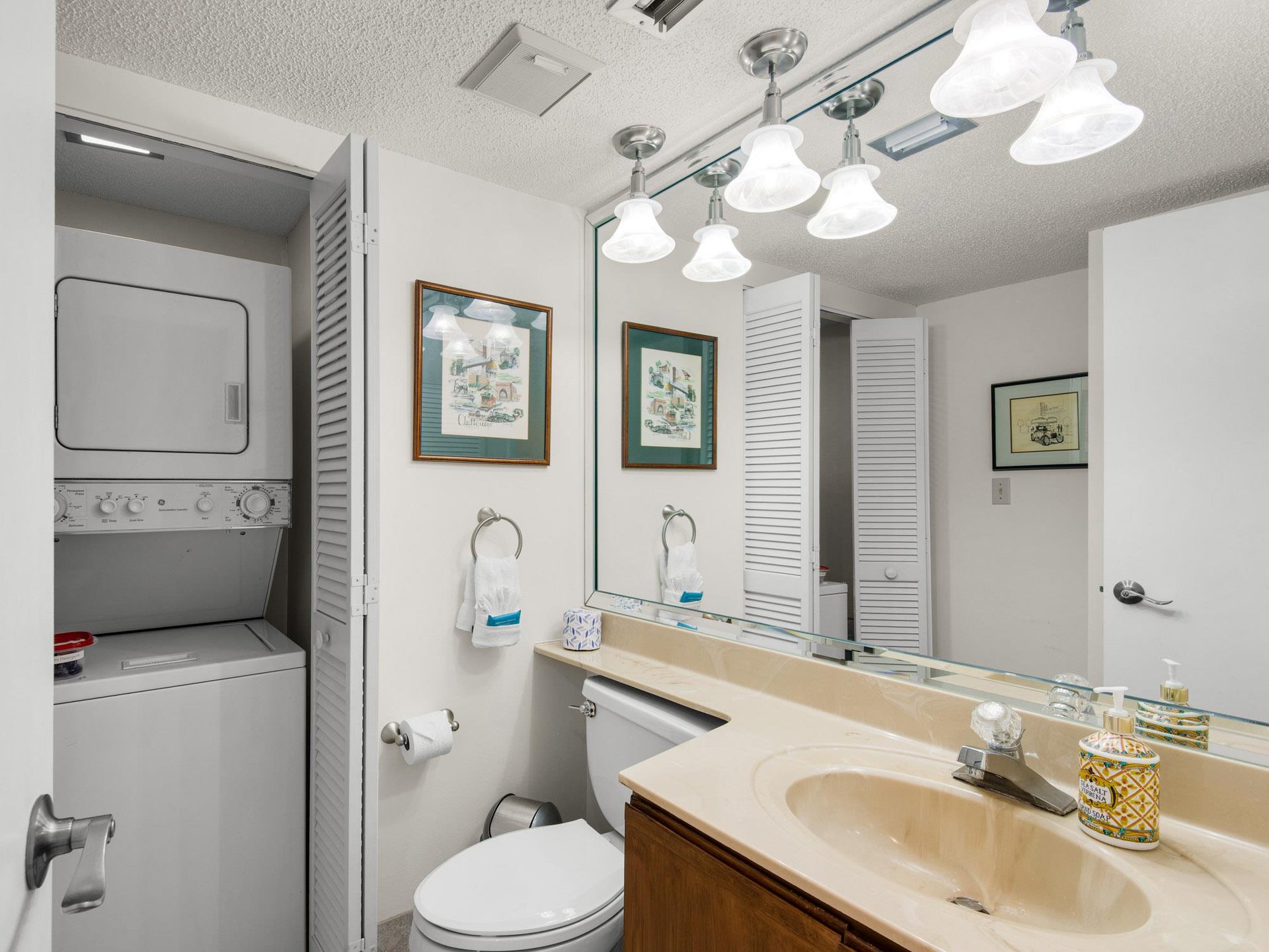 Your bathroom offers convenience with a washer and dryer tucked right in the closet