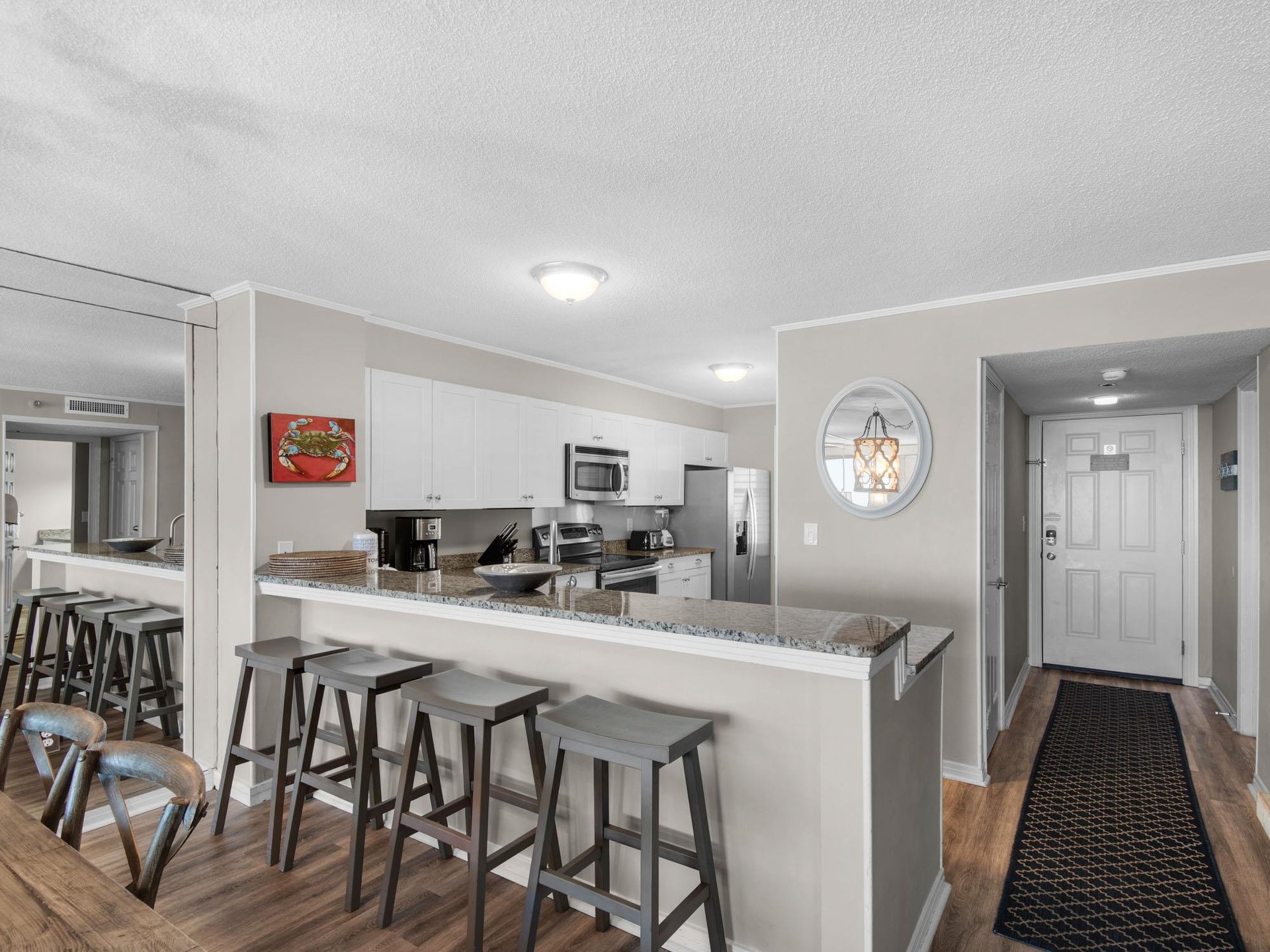 Step into your fully equipped kitchen with breakfast bar seating, granite countertops, and stainless steel appliances—ready for cooking and gathering with loved ones.