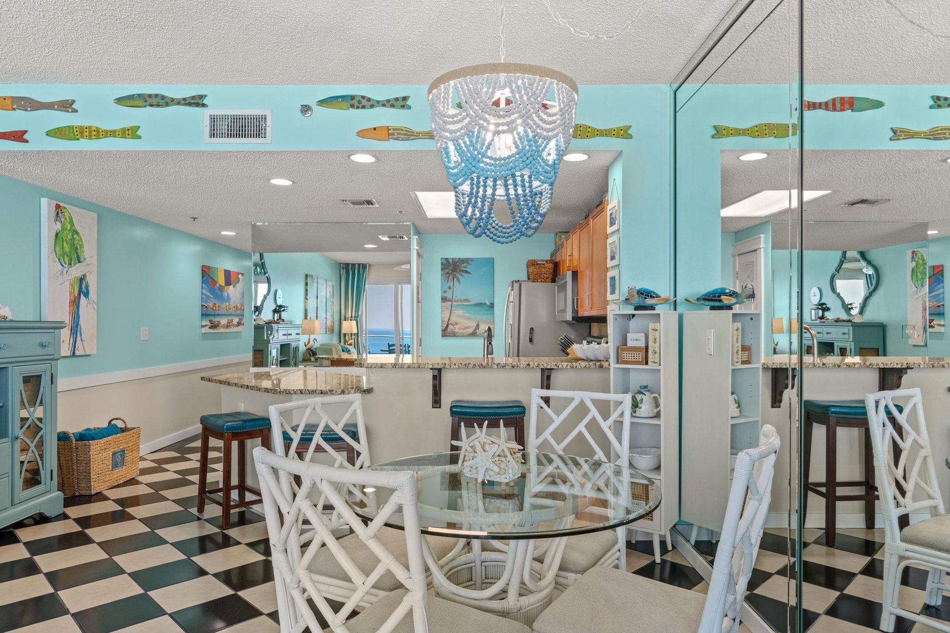 Dining area where playful fish murals surround your open kitchen and dining area.
