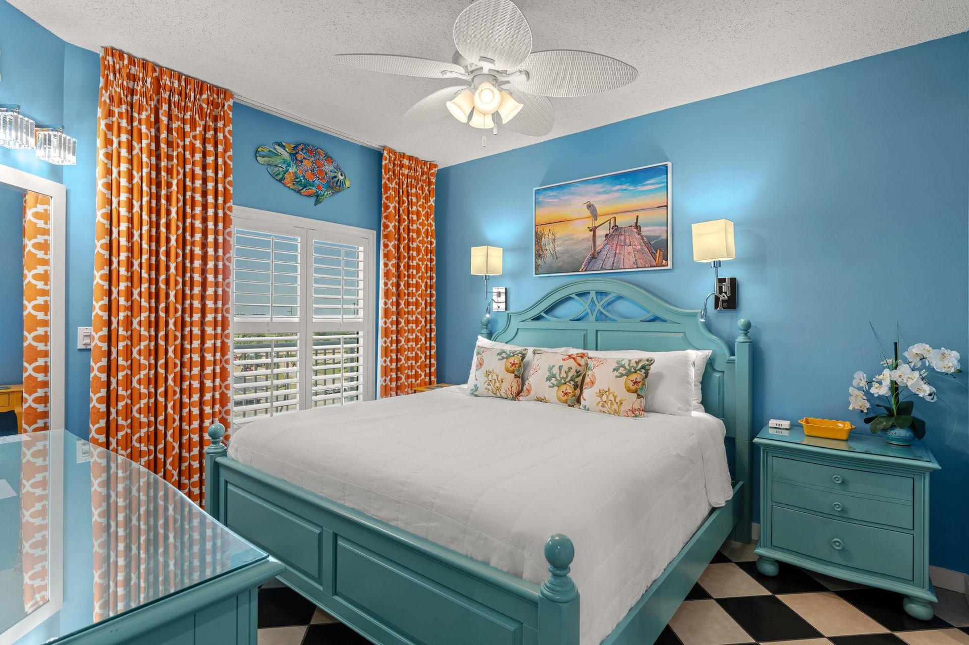 Sink into crisp white linens in this cheerful coastal Bedroom 1