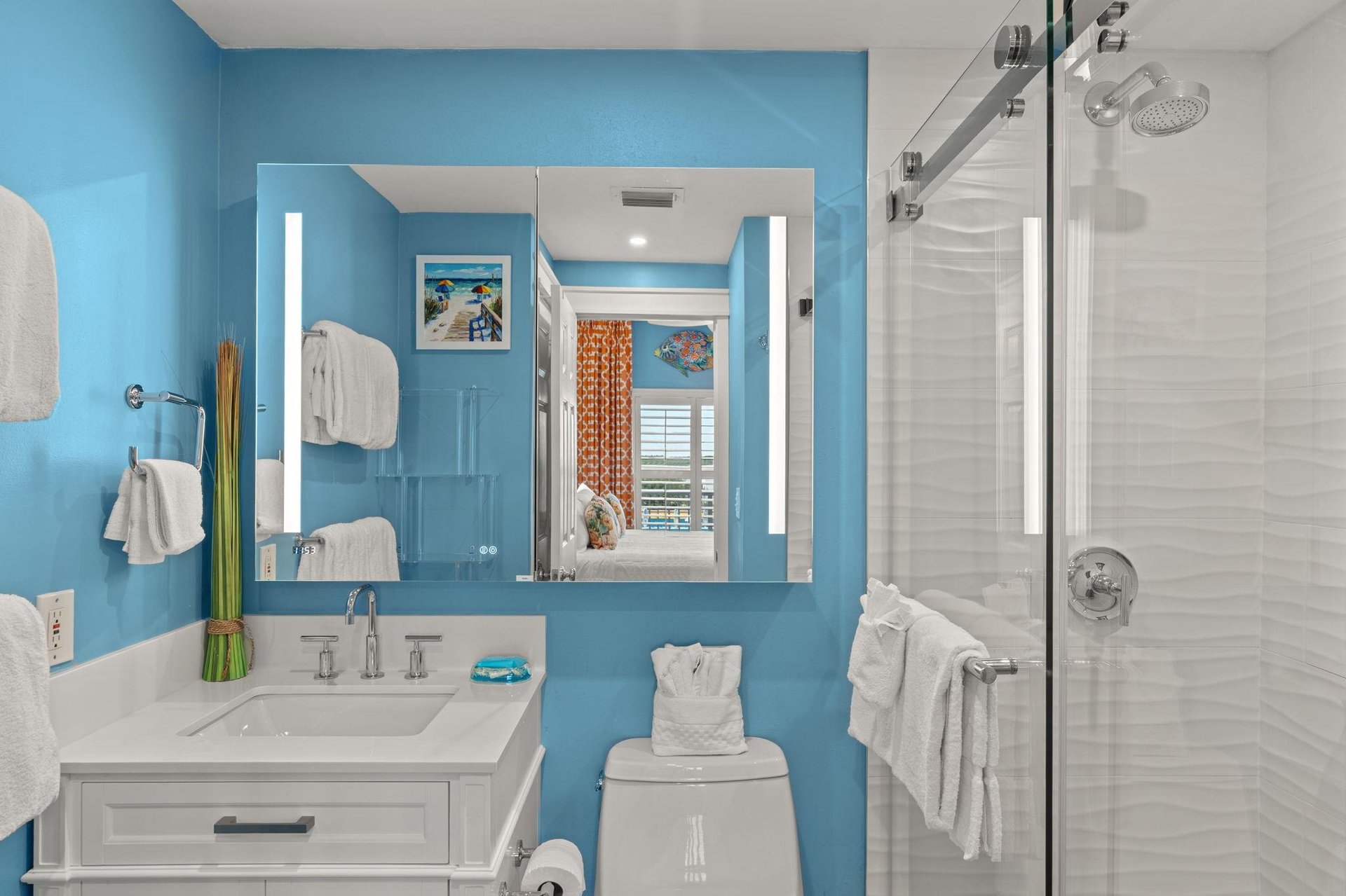 Bathroom 1 with a walkin shower and a bright vanity