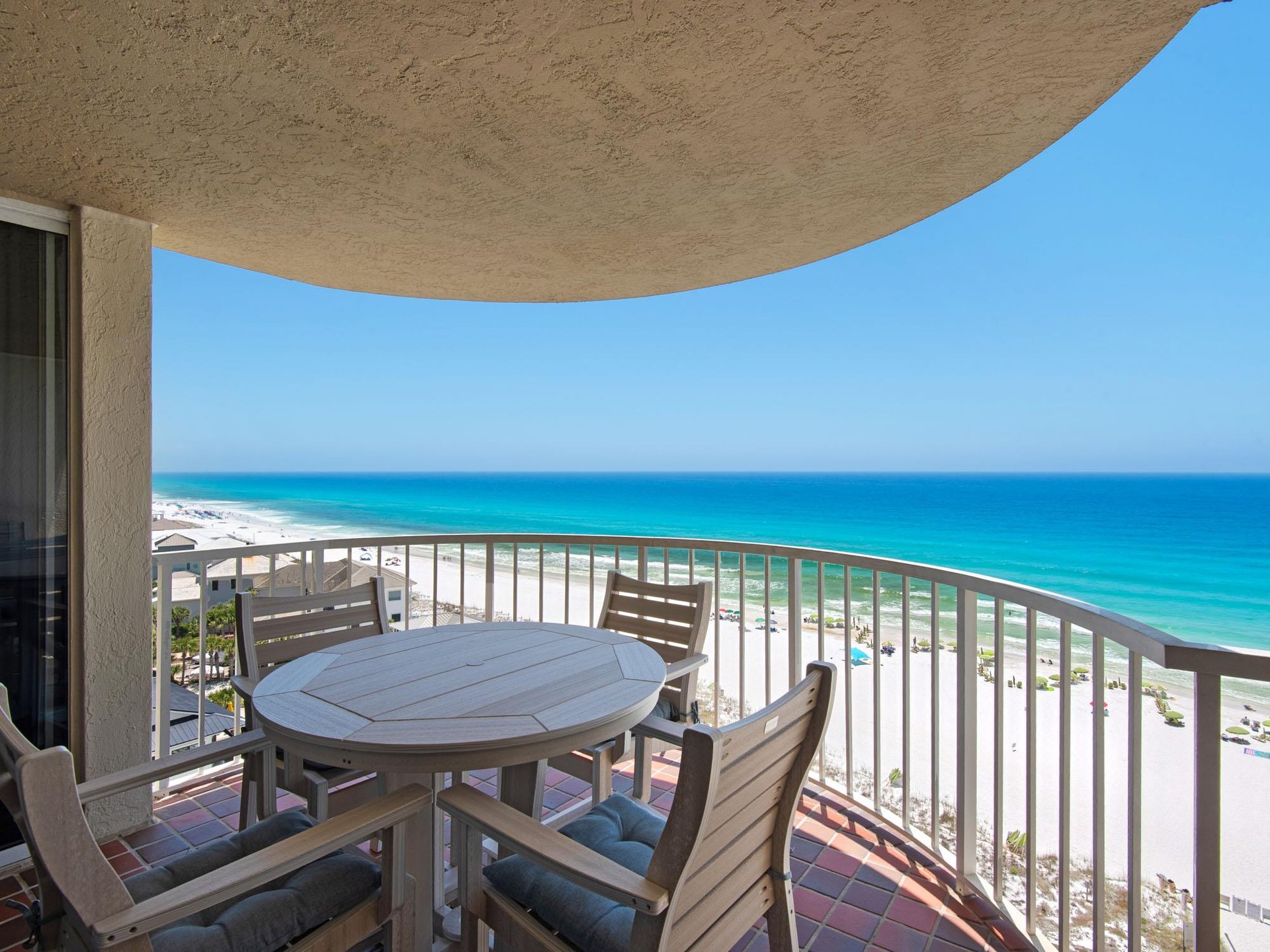Your private balcony overlooks stunning turquoise waters and white sandy shores—perfect for morning coffee or sunset cocktails