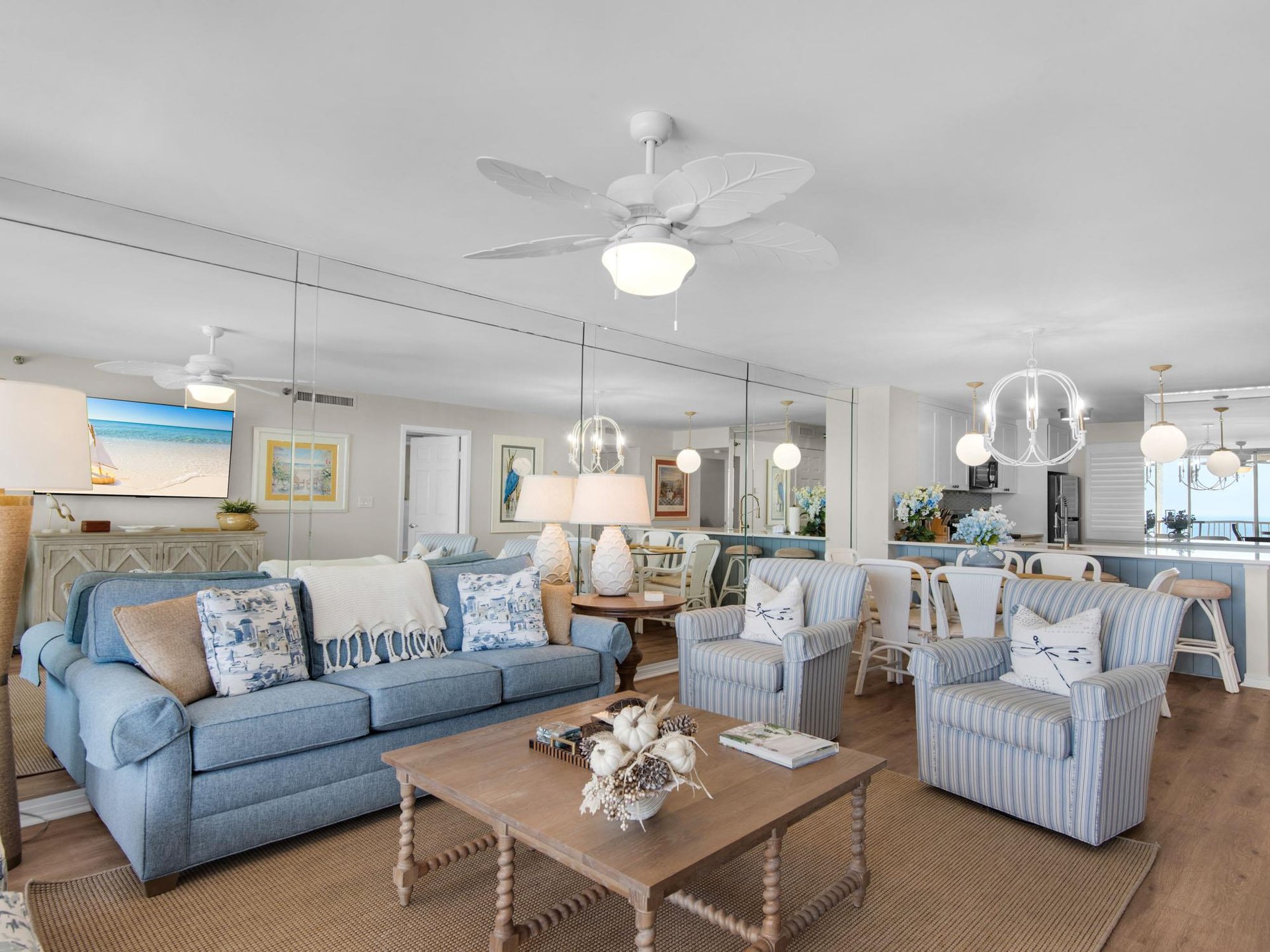 Relax in your bright coastal living space, where soft blues, nautical accents, and elegant decor invite you to unwind in beachy comfort. Lightfilled and open, its your perfect getaway haven.