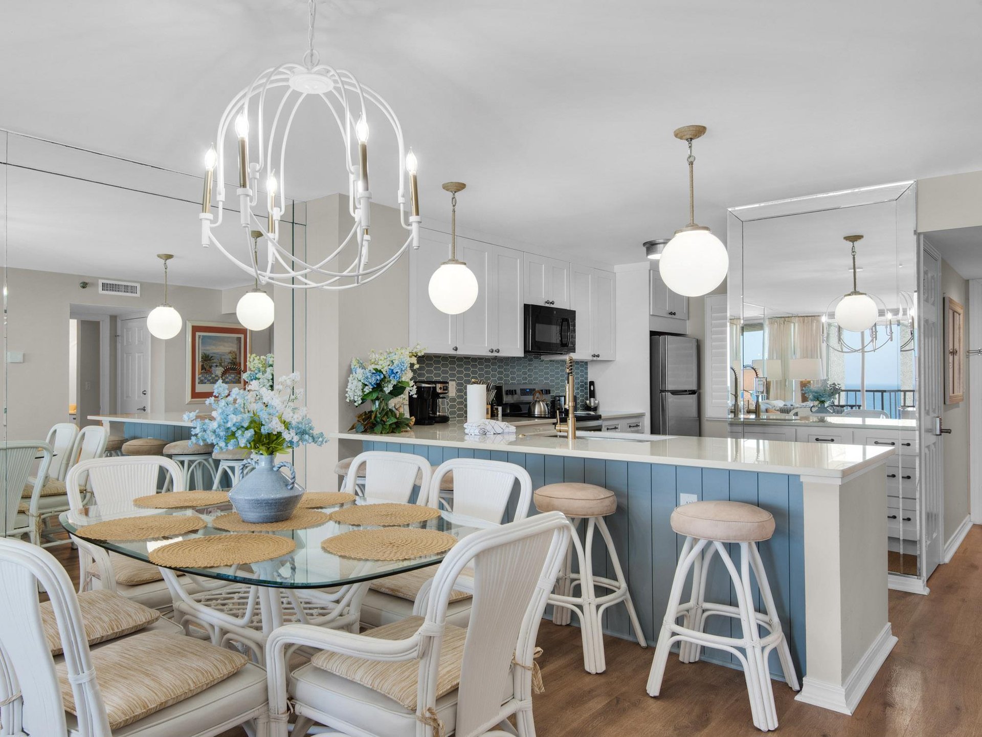 Kitchen and dining area features a welcoming island with bar seating