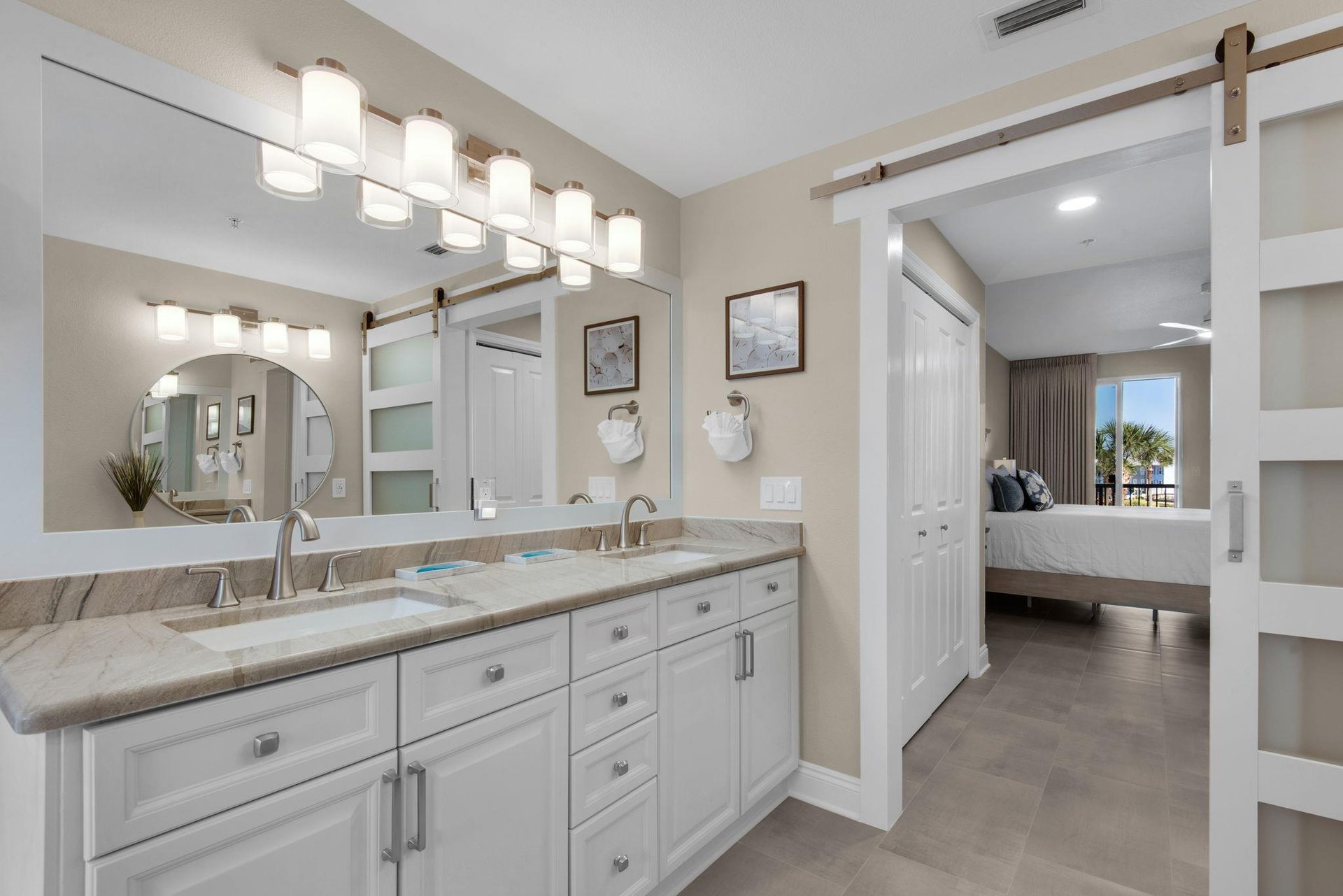 Step into the bright, spalike bathroom with dual sinks and sleek cabinetry