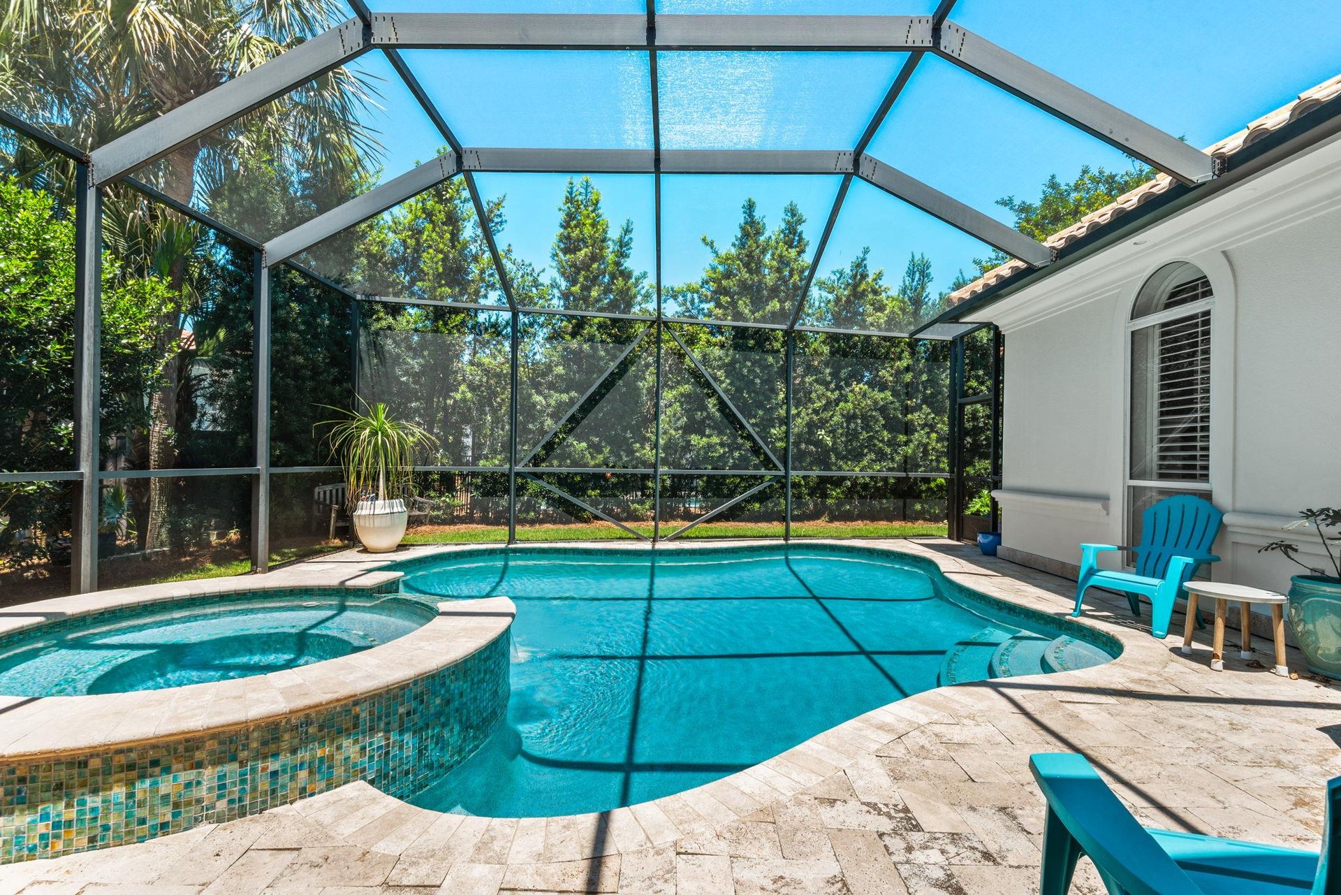 Dive into your private screened pool or soak in the spa
