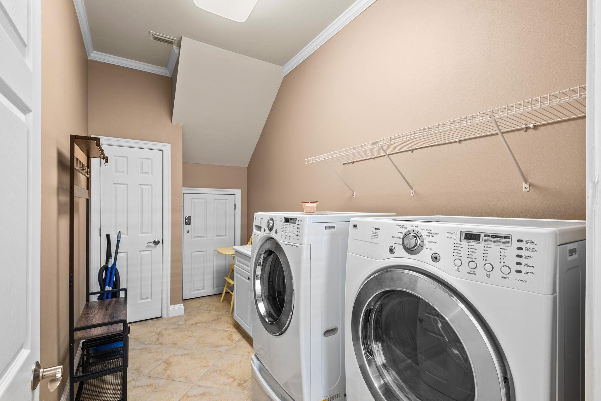 A dedicated laundry space awaits, complete with a fullsize washer and dryer—