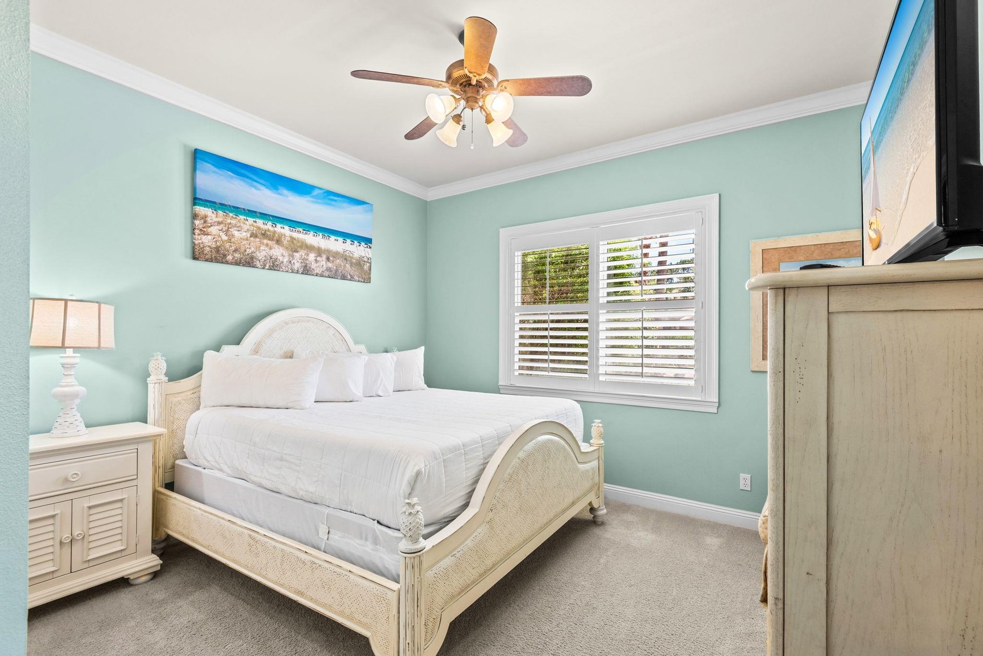 Unwind in this serene bedroom with its soothing coastalinspired palette promises restful nights and relaxing mornings.