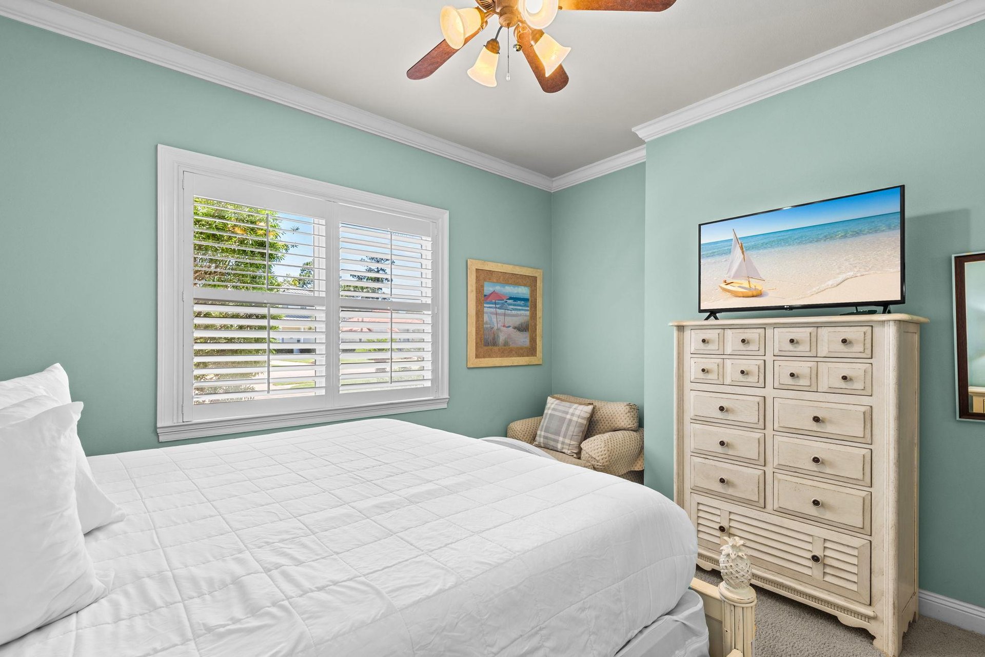 This peaceful retreat features calming coastal tones, a plush bed for restful nights, and beachinspired touches.