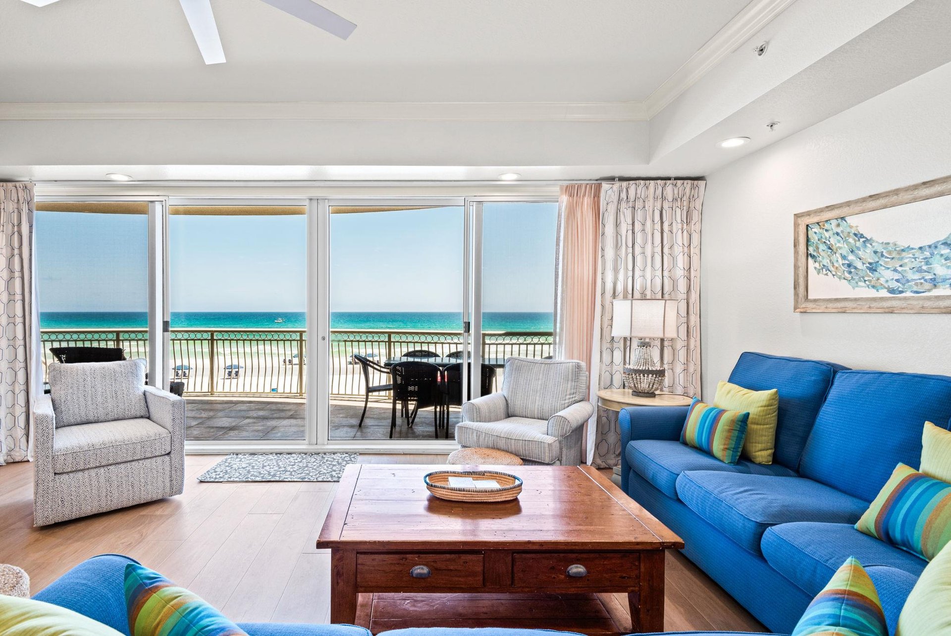 Unwind on plush sofas as your balcony frames stunning turquoise waves and soft sands just steps away.