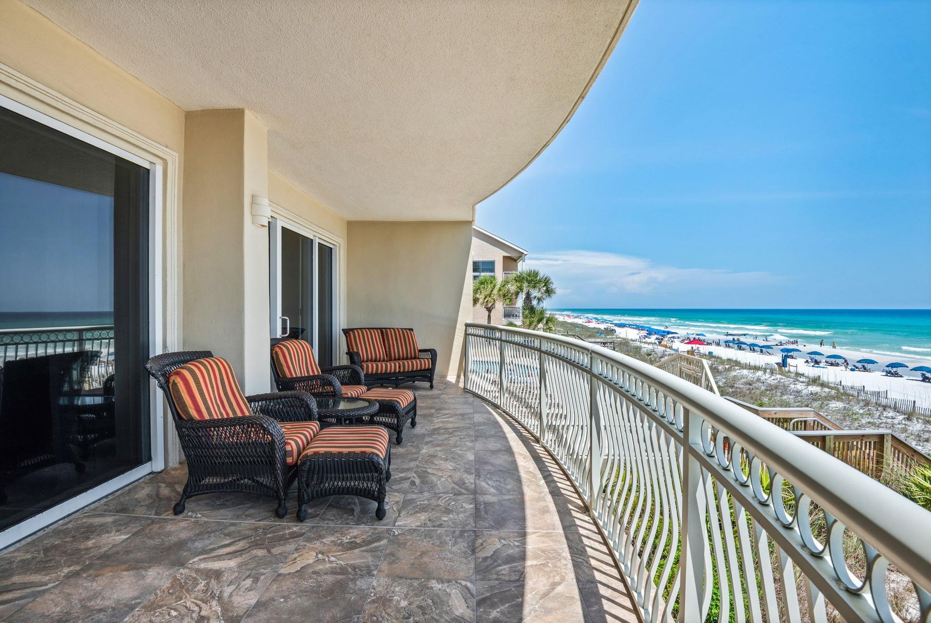 Lounge in cushioned chairs with footrests as gentle ocean breezes and the sound of waves create your perfect beach retreat.