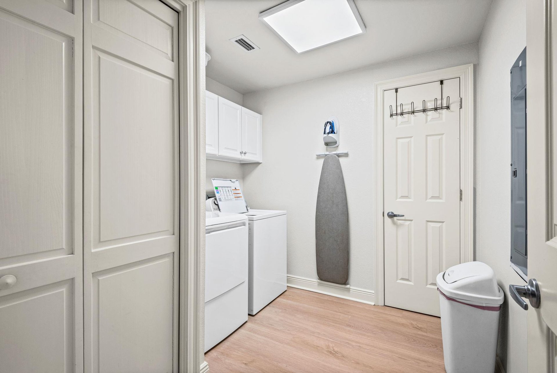 Laundry room with a fullsize washer and dryer makes packing light and staying fresh effortless during your stay.