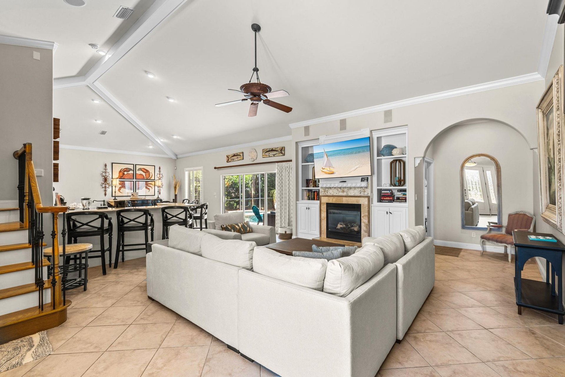 Unwind in the spacious living room with soaring ceilings, a cozy fireplace, and plenty of room to relax