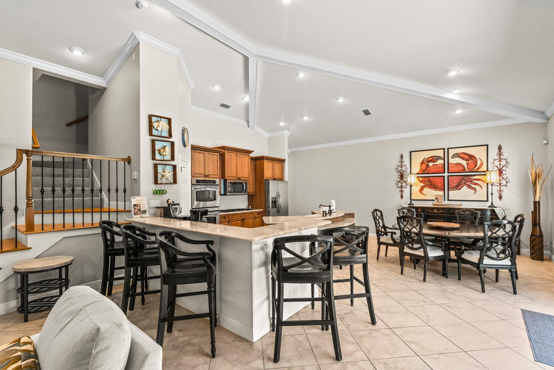 This openconcept kitchen and dining area are bright, spacious, and perfect for your group