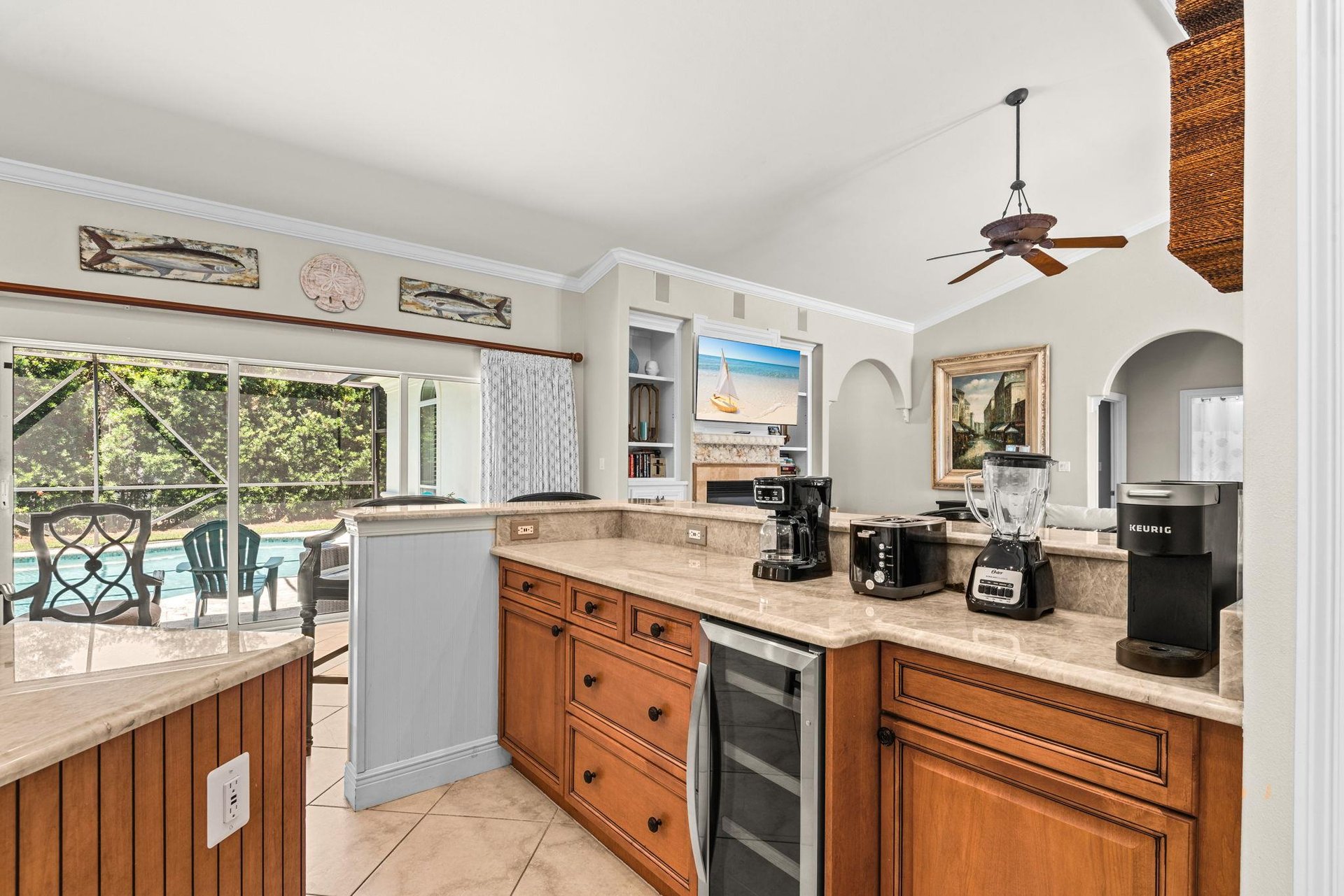 The gourmet kitchen awaits with quality appliances, and a coffee station—