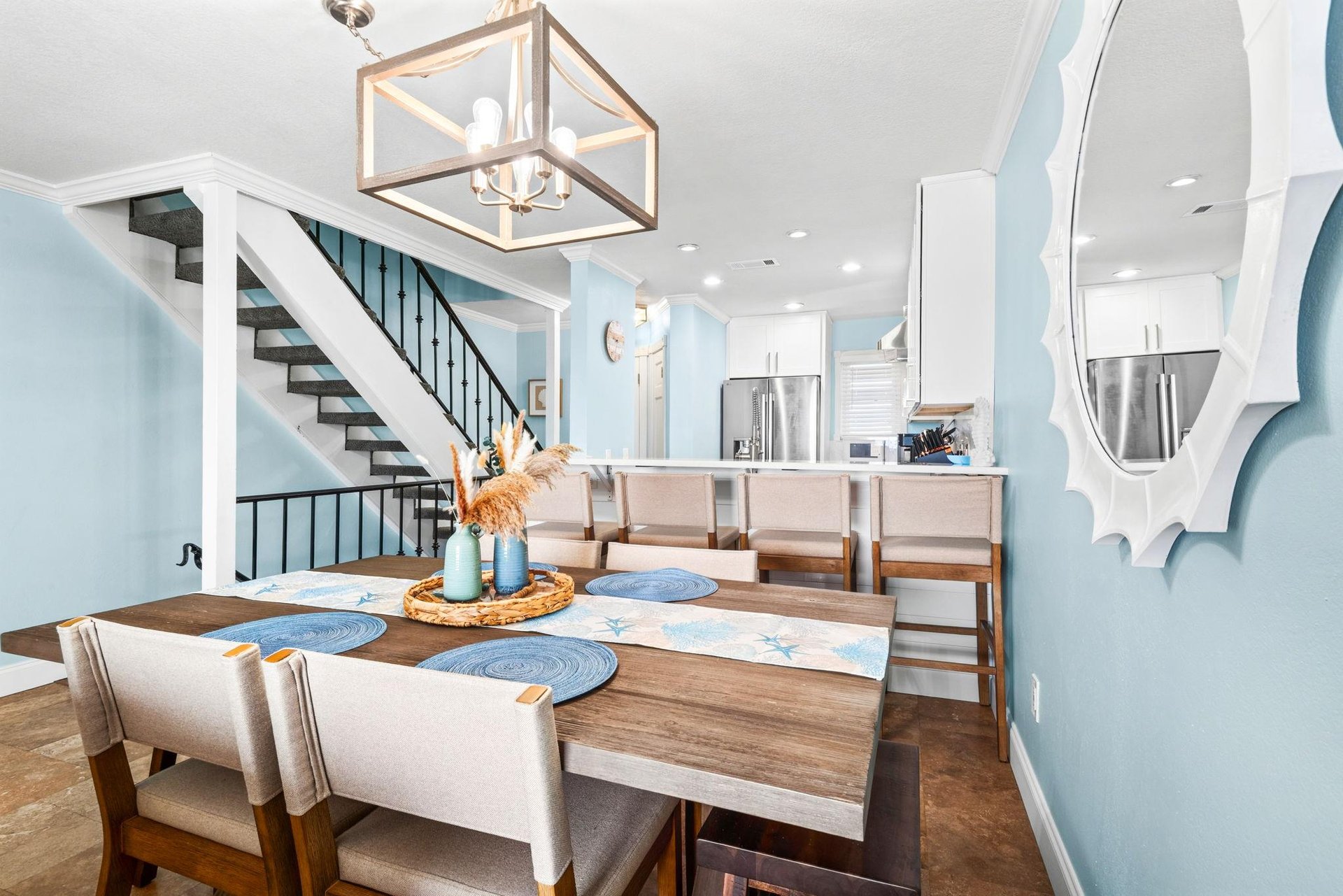 Savor memorable meals under elegant pendant lighting and open kitchen views.