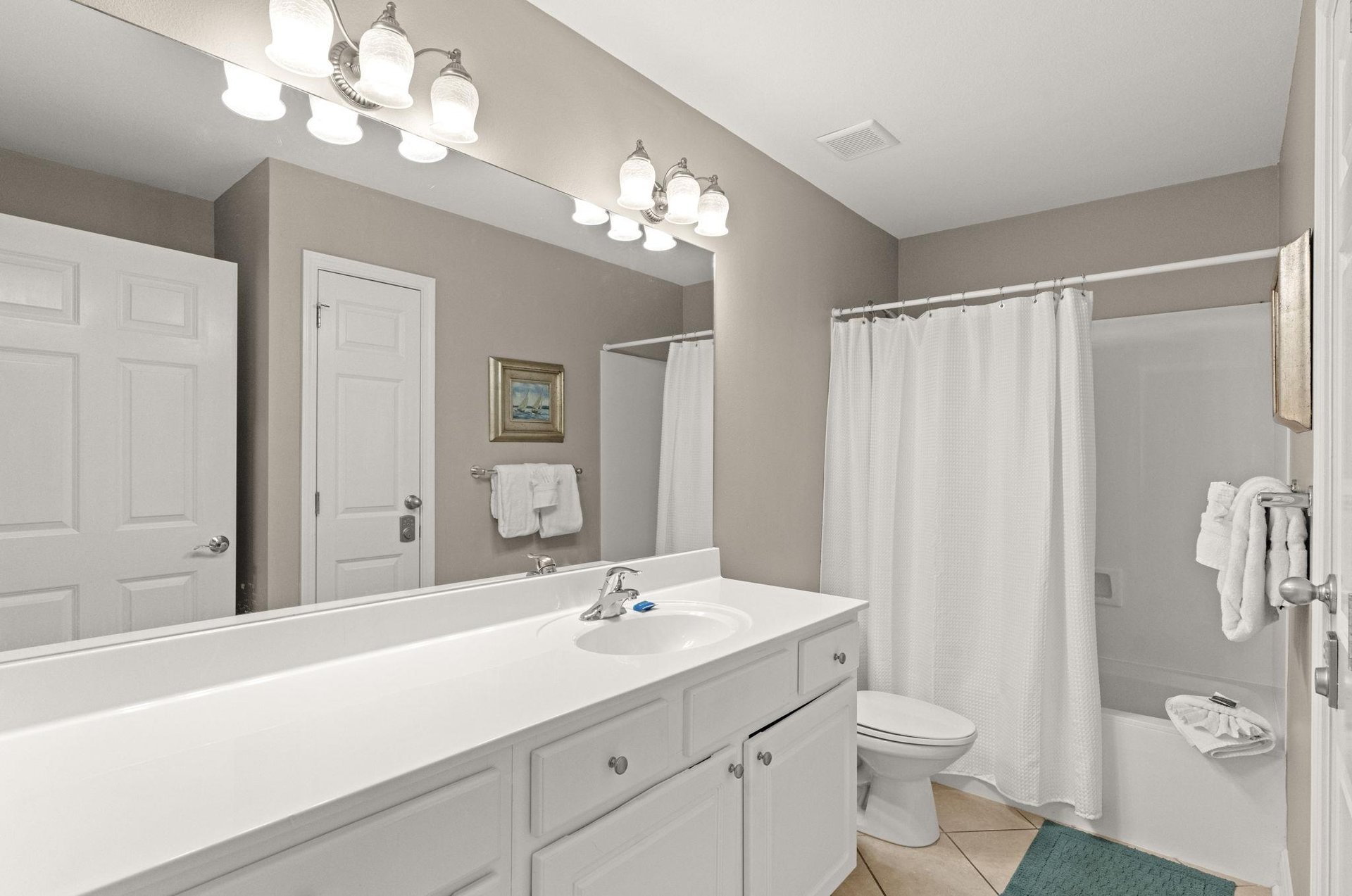 Freshen up in your guest bathroom, complete with and a soothing neutral palette that invites relaxation after a day of adventure.