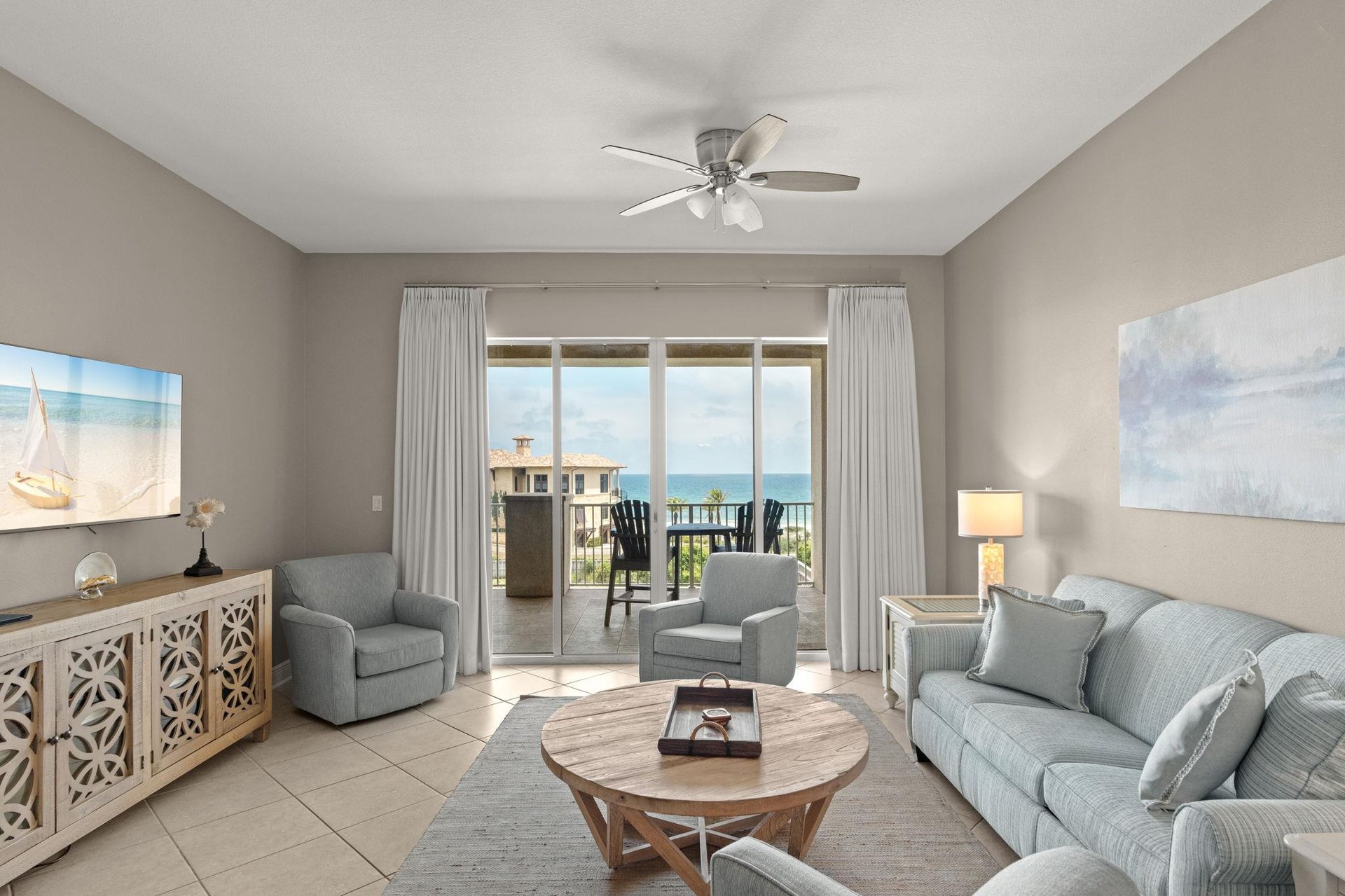 Step into your coastal retreat with soft colors and natural light. Relax on the cozy sofa or enjoy morning coffee while taking in ocean views from your private balcony.