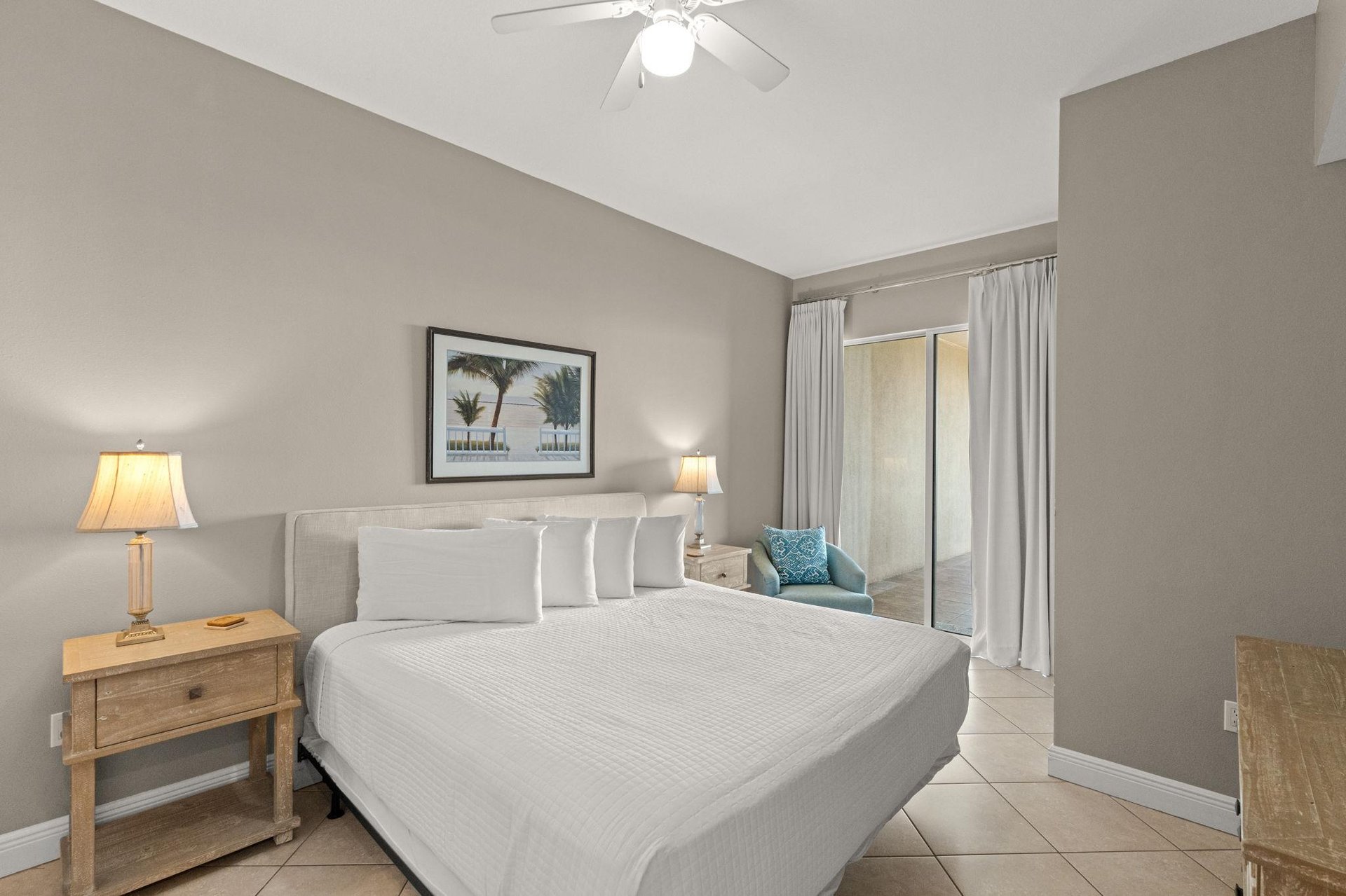 Sink into plush linens and unwind in your peaceful bedroom retreat, where soft lighting and soothing coastal touches create the perfect atmosphere for restful nights.