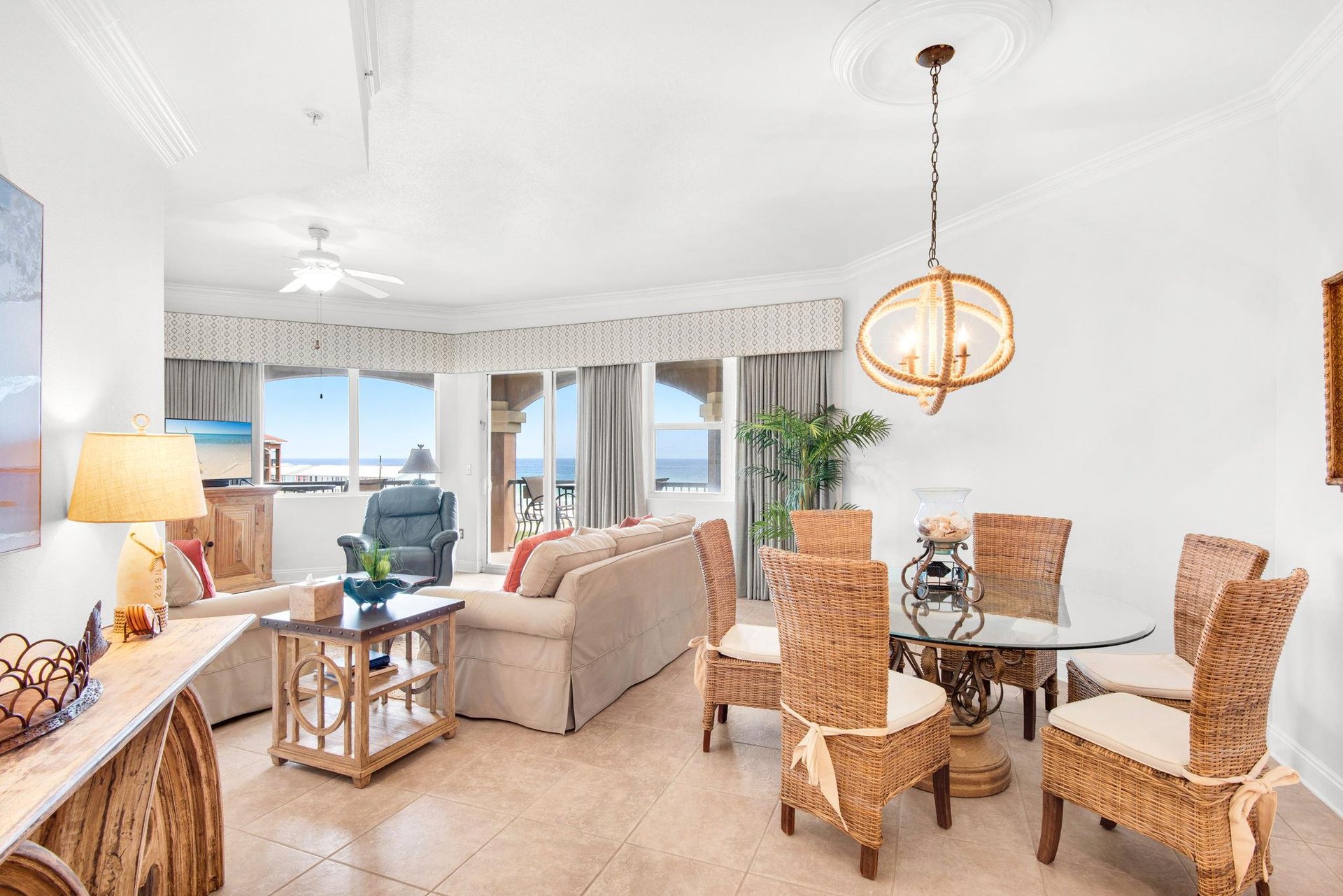 Natural light fills the bright space, where wicker chairs and beachinspired décor set a tranquil coastal tone.
