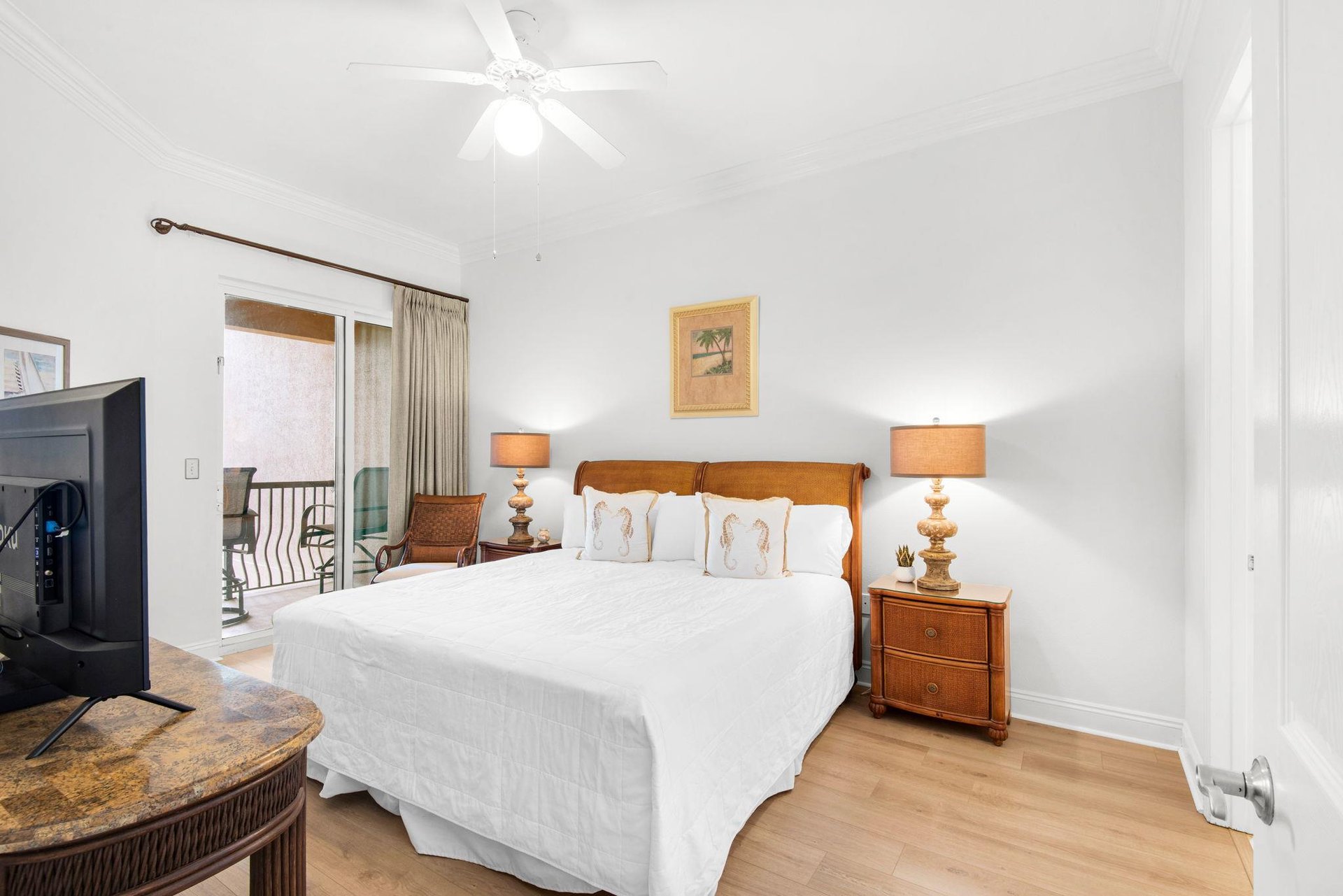 Sink into crisp linens and elegant tropical decor, with a private balcony just steps away.