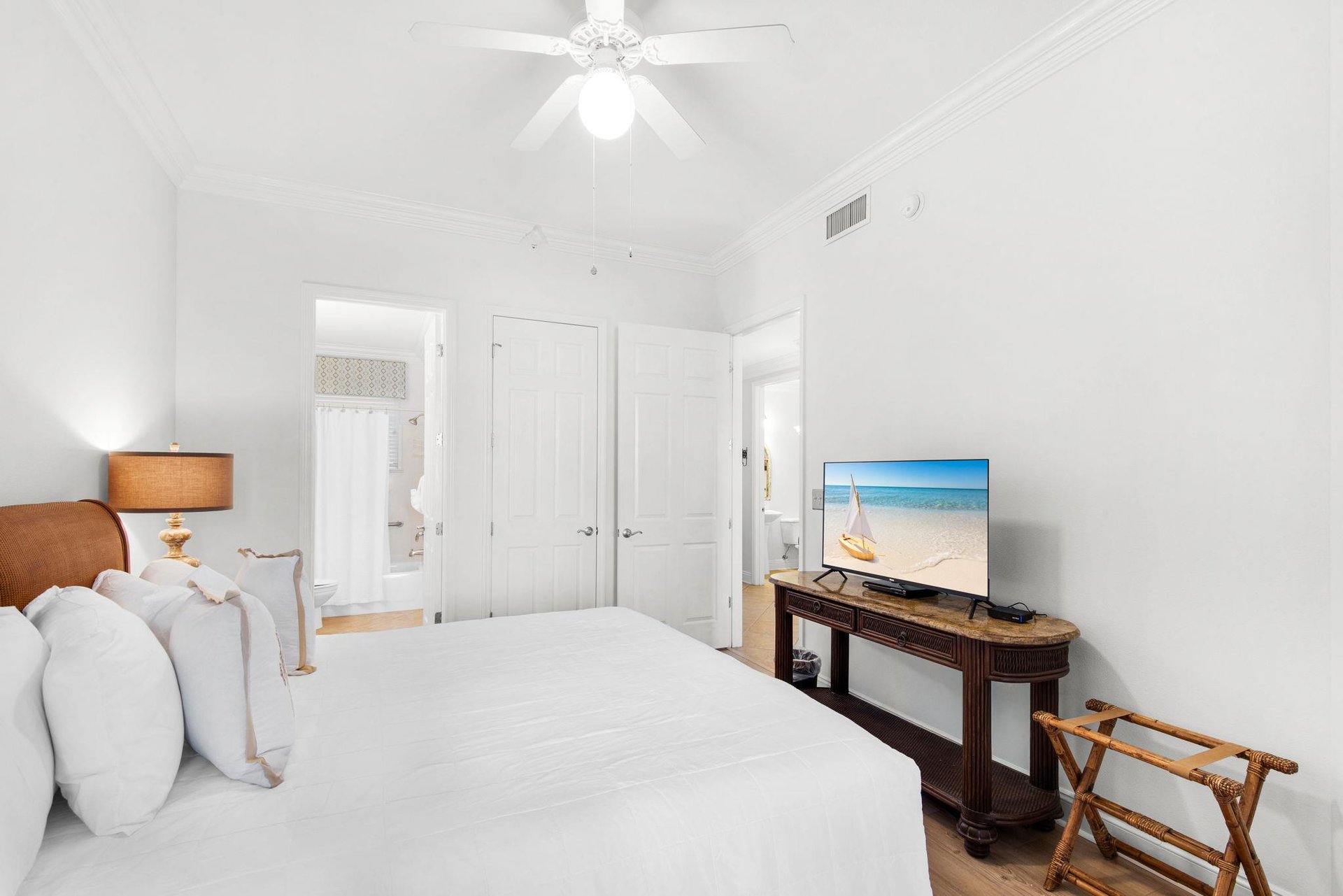 Drift off to sleep in this serene bedroom where coastal charm and modern comforts create your perfect retreat.