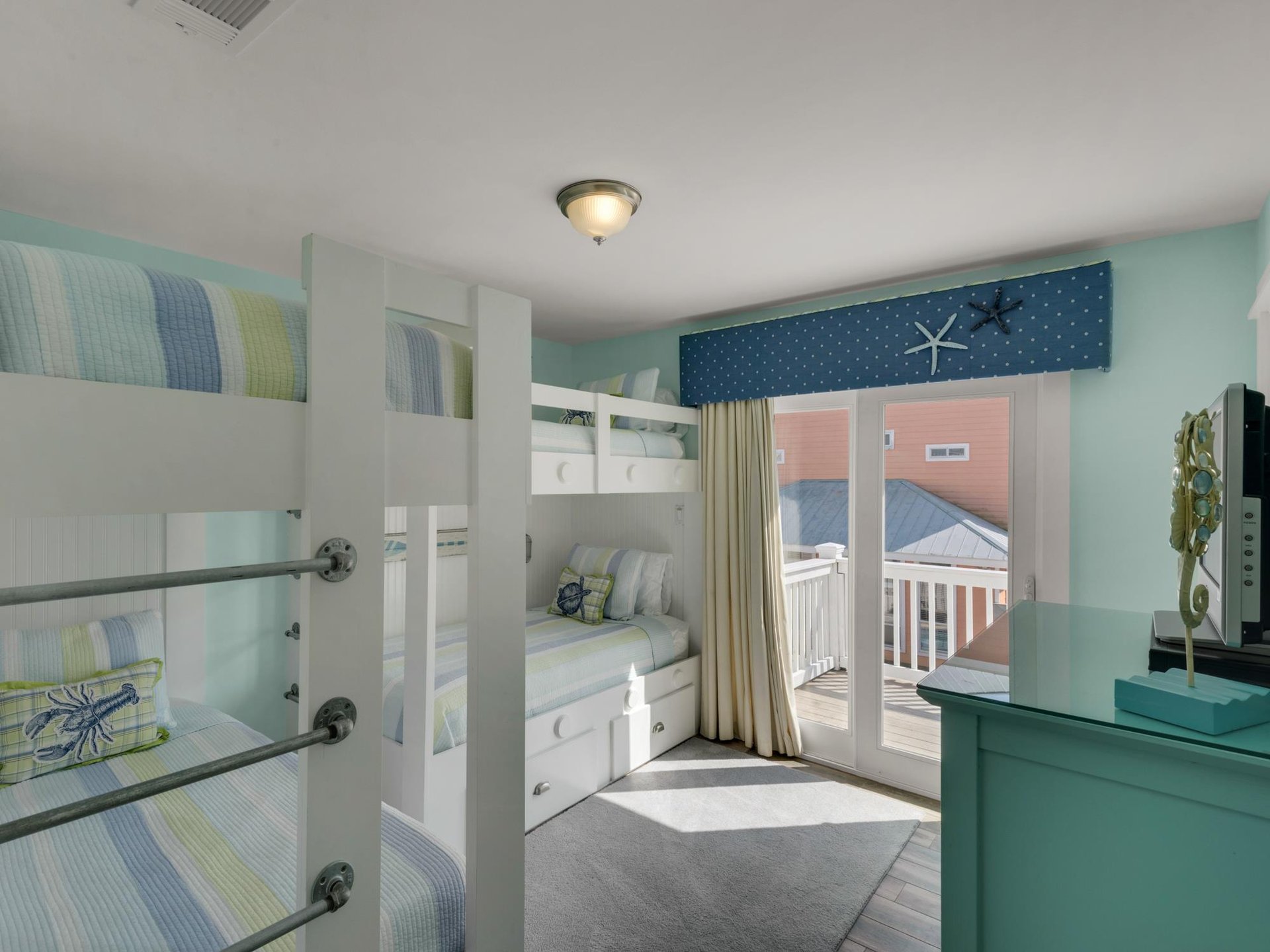Bunkroom with Flat Screen TV and Balcony Access