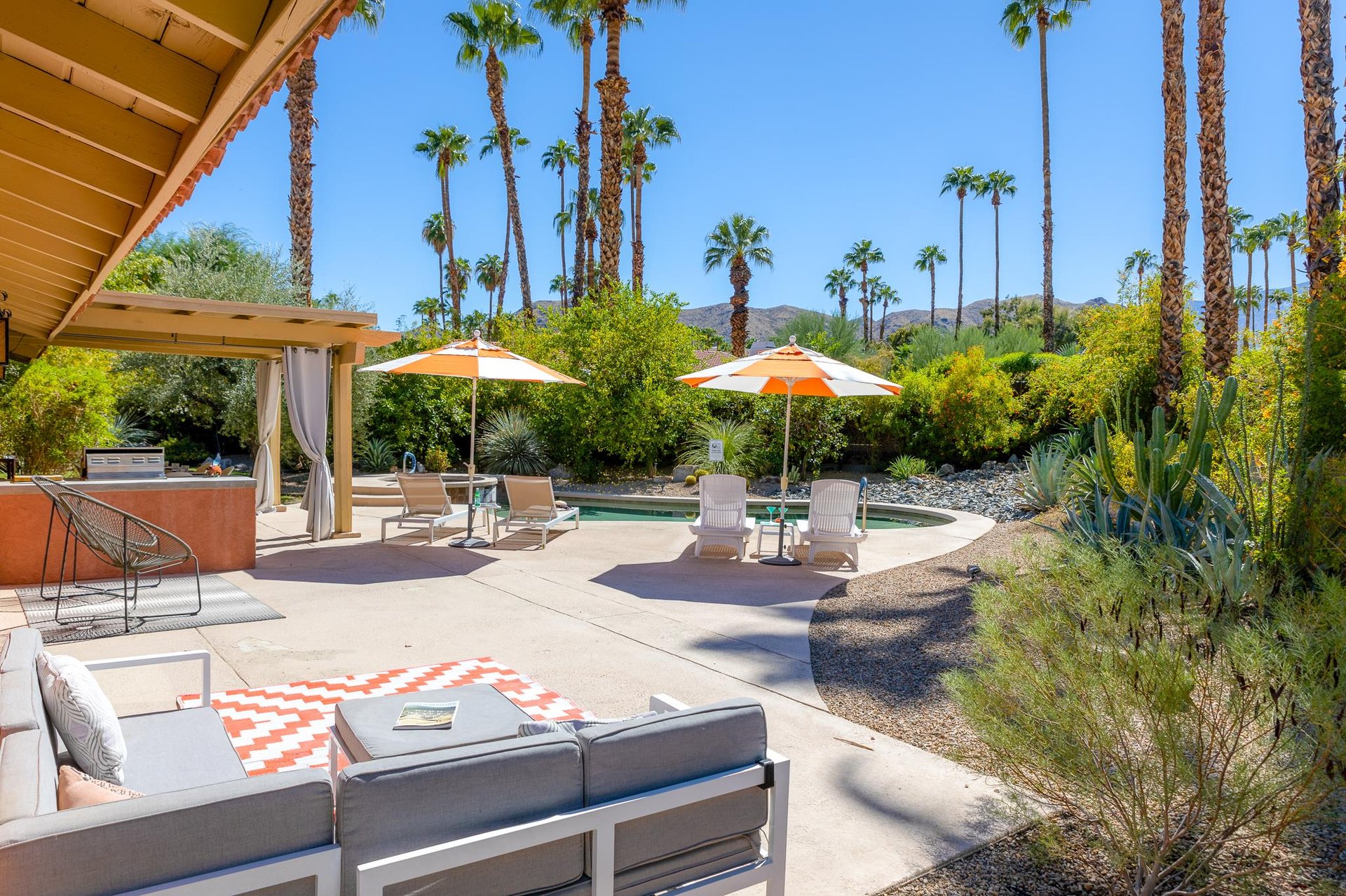 Multiple sitting areas in this beautiful back yard
