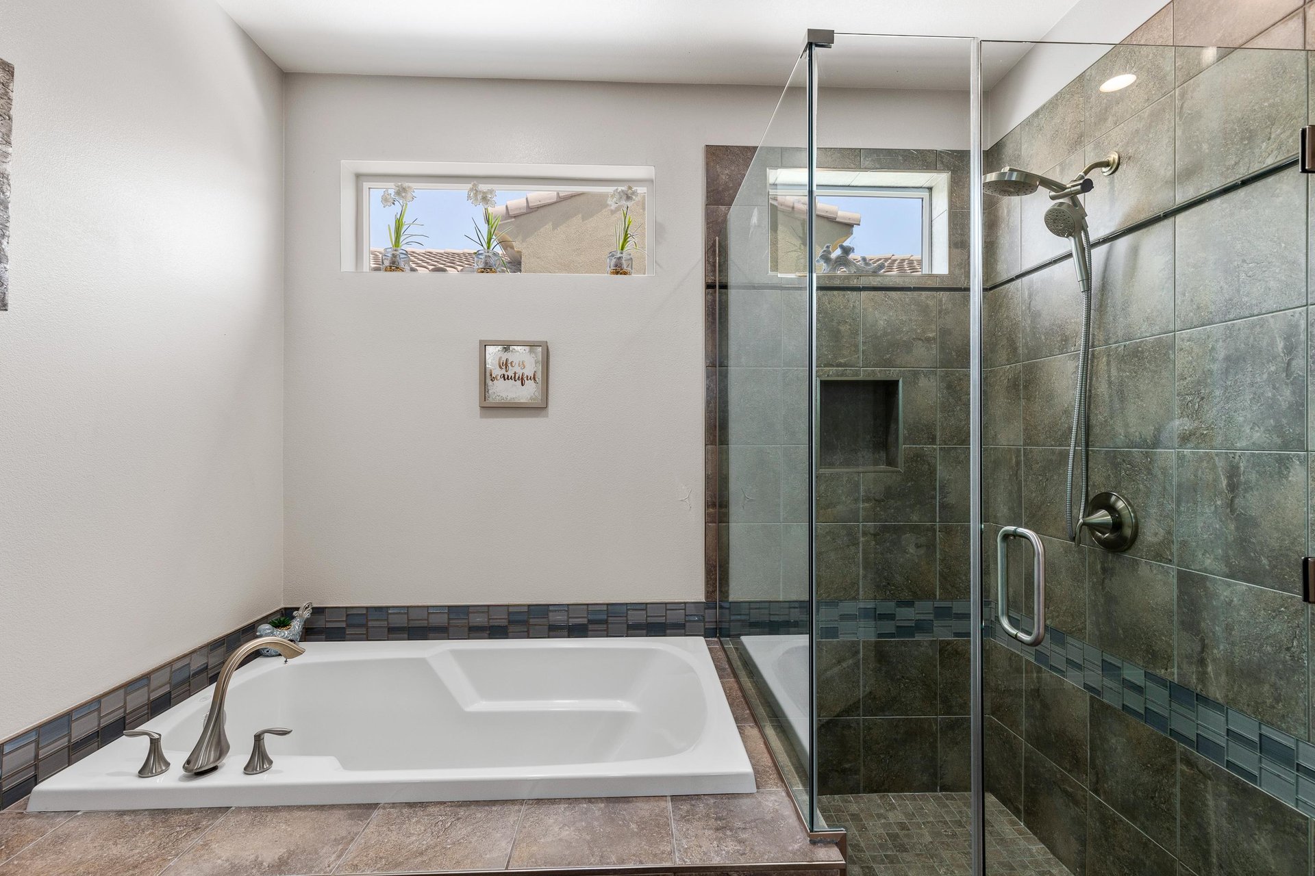 Enjoy a bath or a shower in the primary suite bathroom