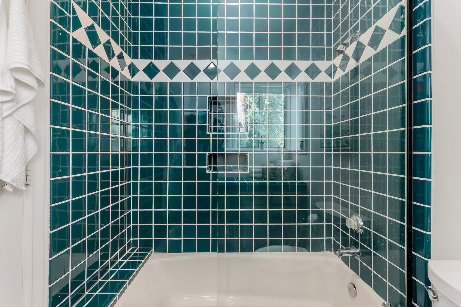 Guest shower tiled in teal