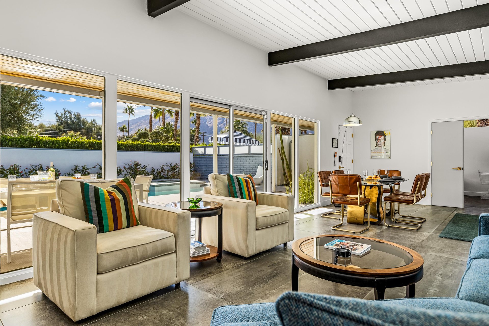 Wall to ceiling open windows let the light in