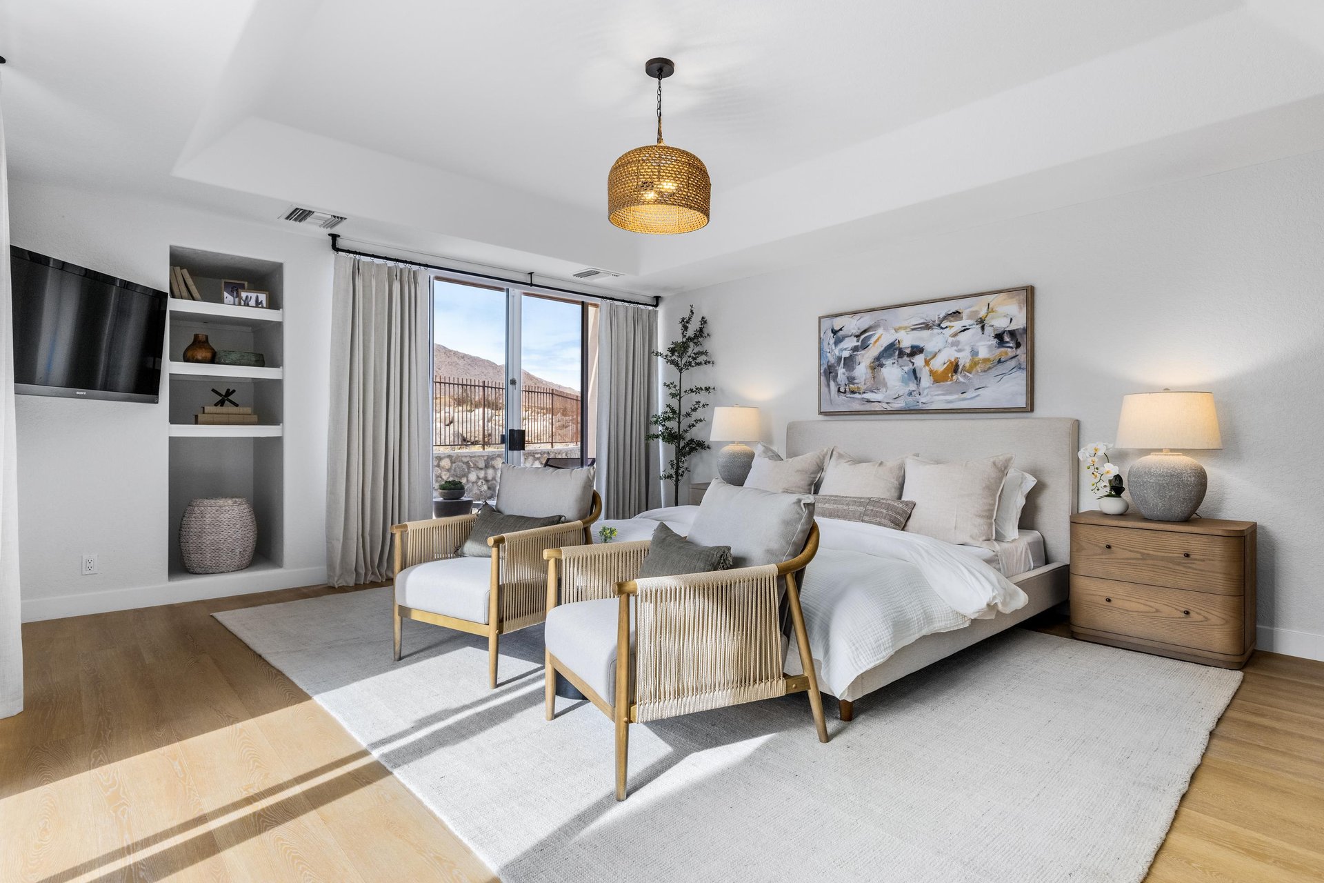 Primary bedroom with cozy chairs