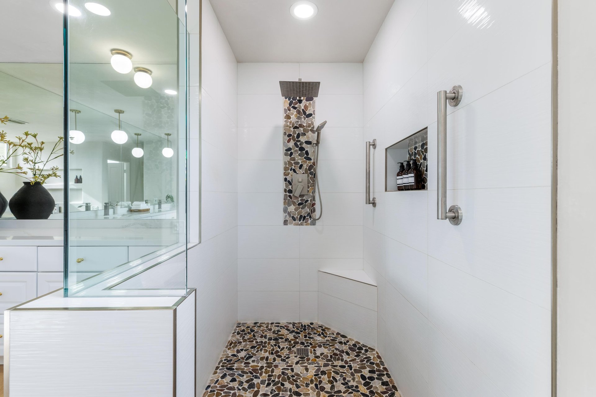 Pebble stone tiled Primary Shower