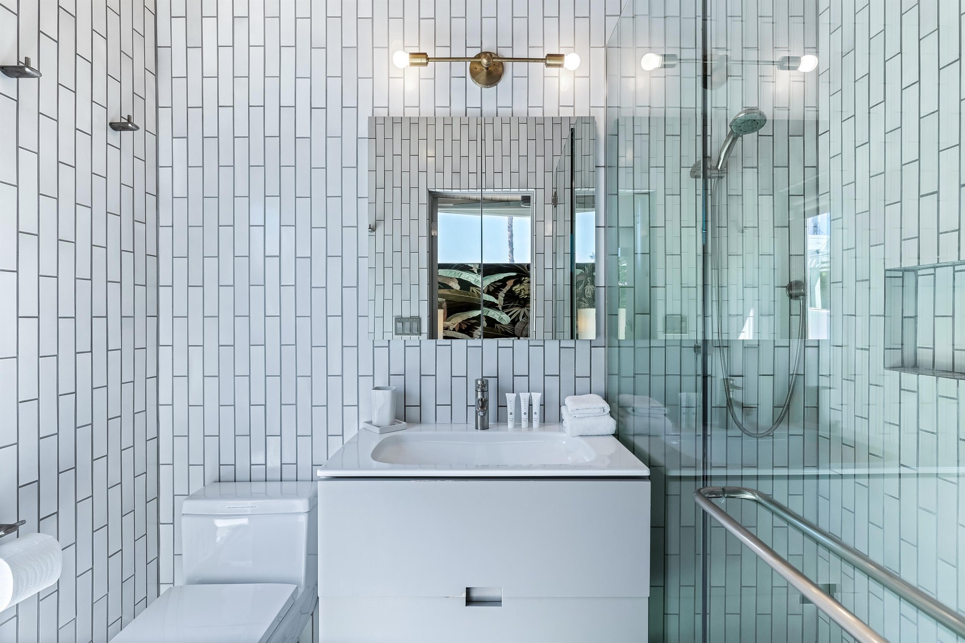 Sophisticated whitetiled ensuite bathroom